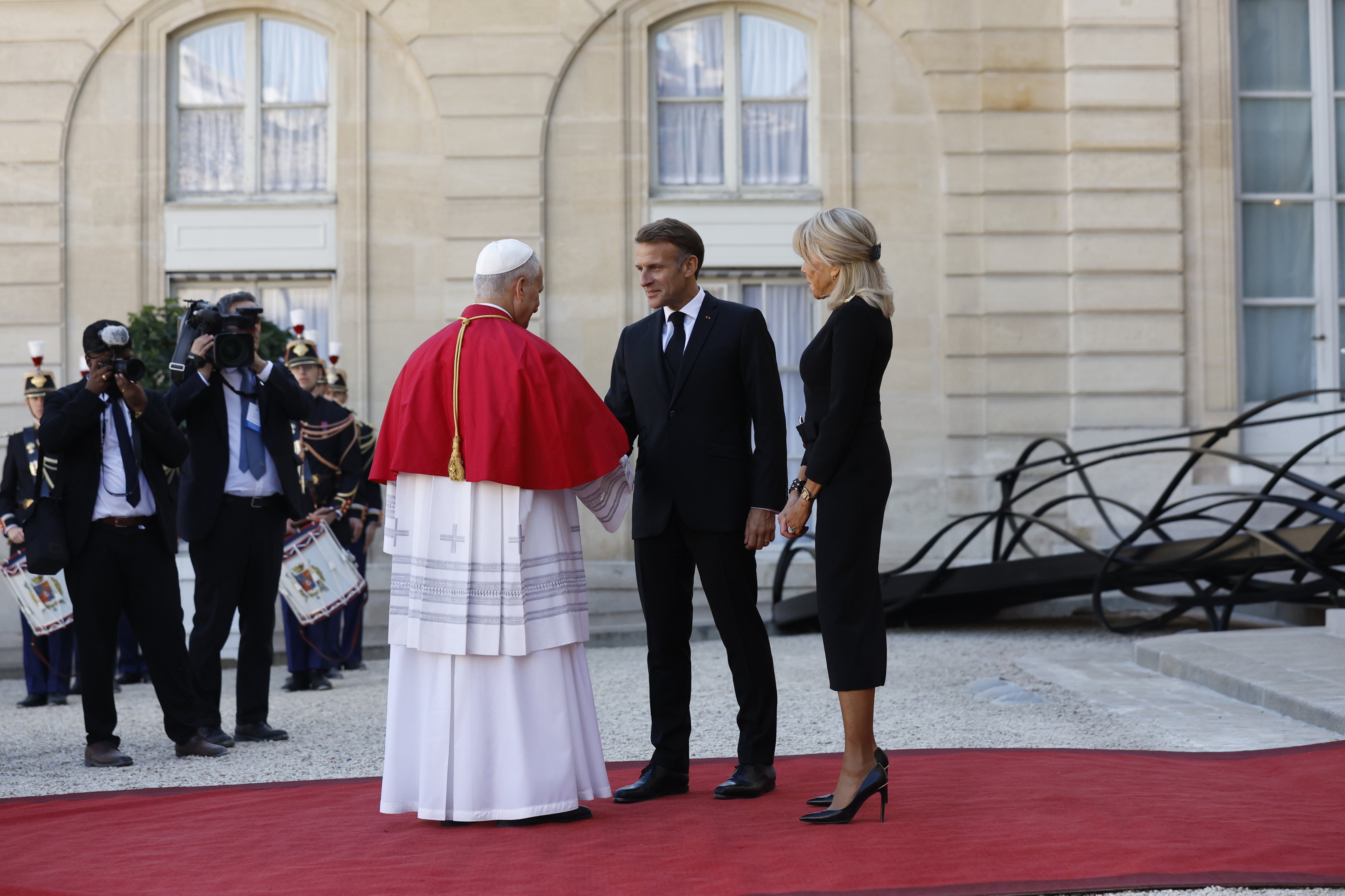French President Emmanuel Macron and his wife Brigitte accompany Pope Leo after their meeting in the Elysee Palace in Paris on Friday. Photo: via AP