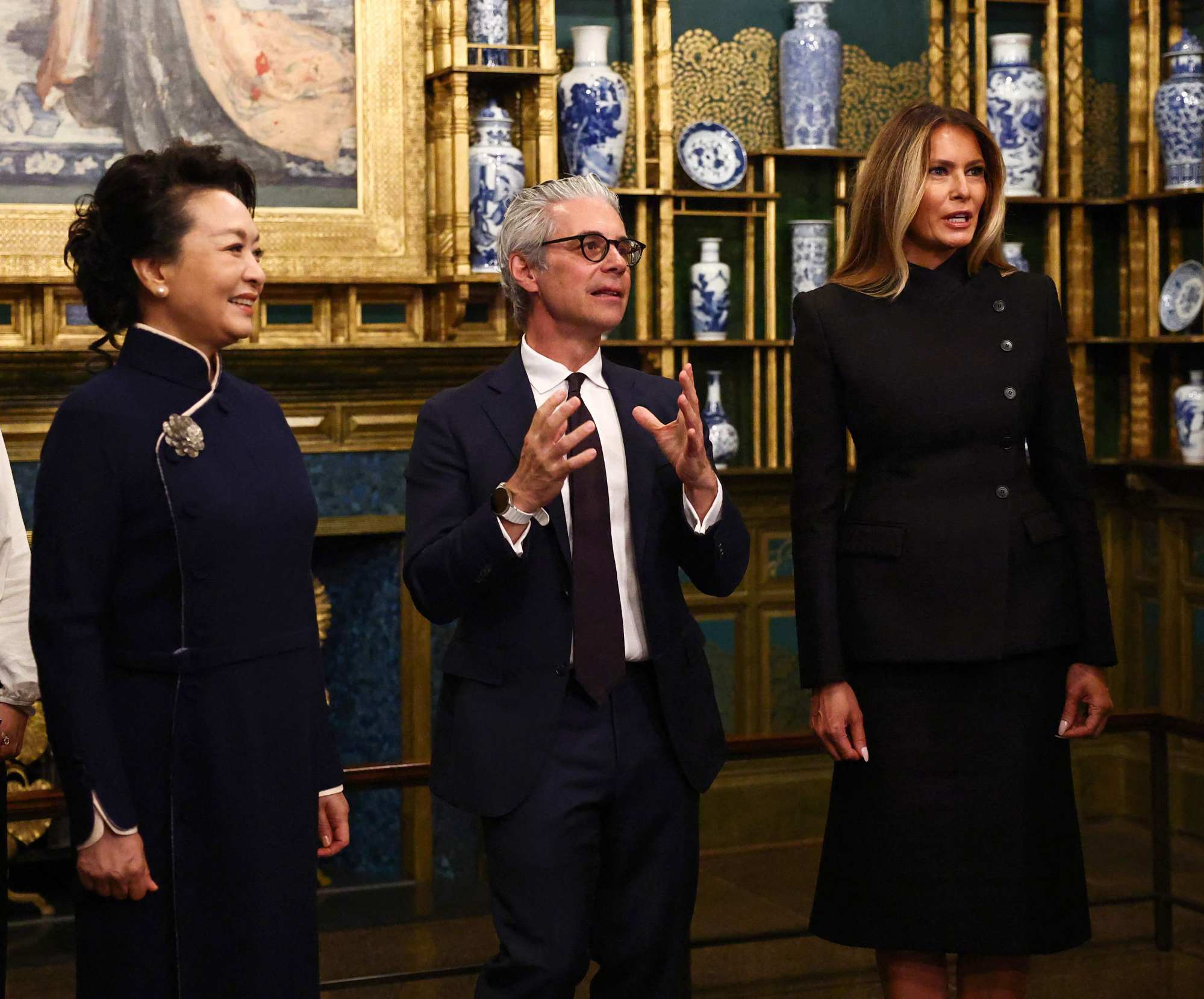 From left, Peng, the Smithsonian’s National Museum of Asian Art director Chase Robinson and Trump during a tour of the Peacock Room. Photo: AFP