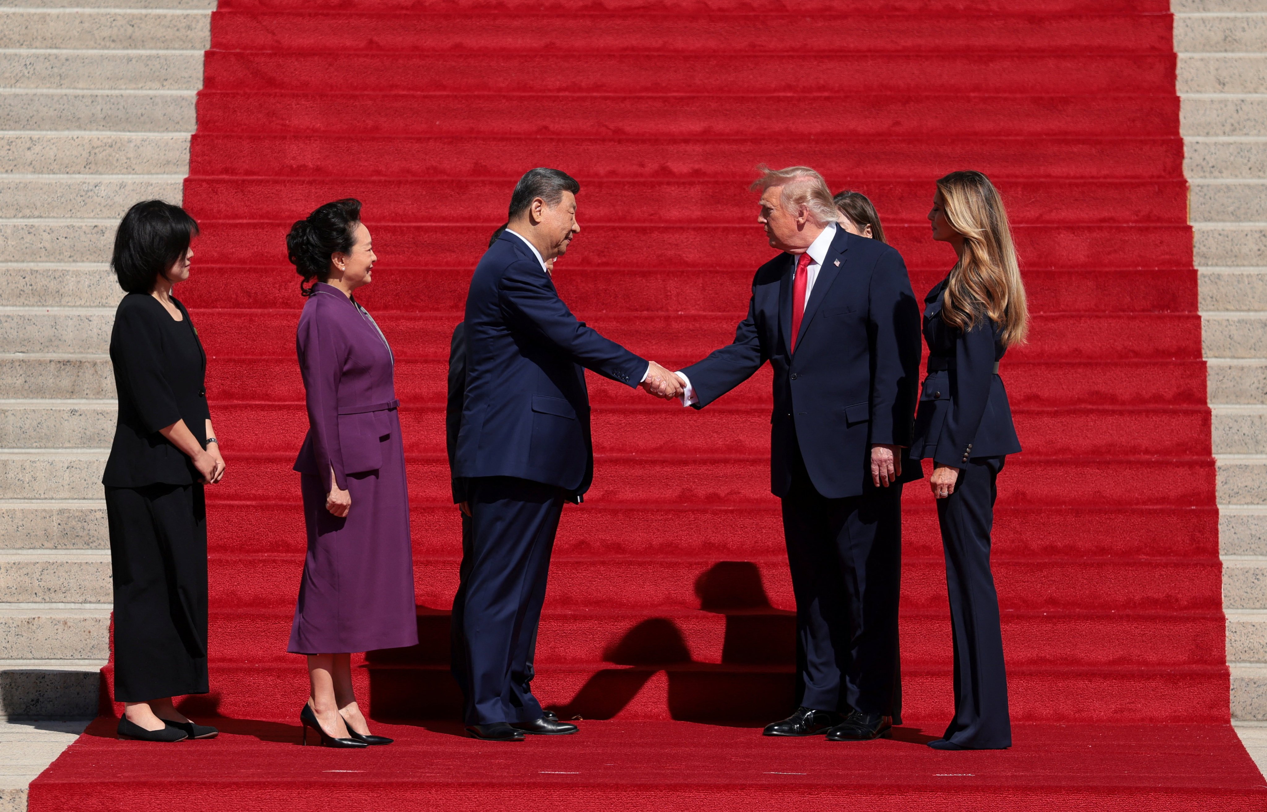 US President Donald Trump and Chinese President Xi Jinping shake hands alongside US first lady Melania Trump and Chinese President Xi Jinping’s wife Peng Liyuan, at the National in Washington on Friday. Photo: Reuters