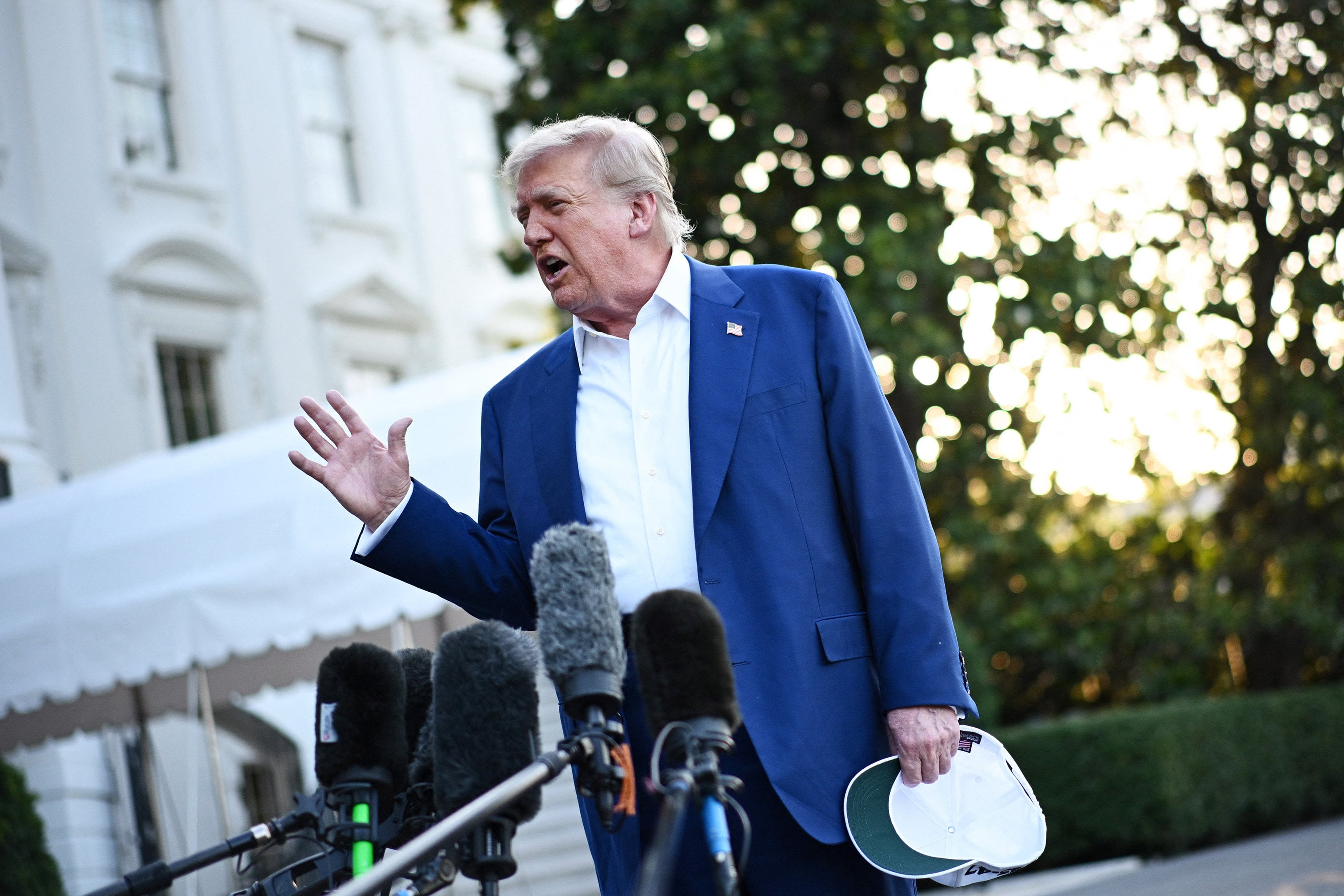 US President Donald Trump speaks to the press before boarding Marine One from the South Lawn of the White House in Washington last year. Photo: TNS