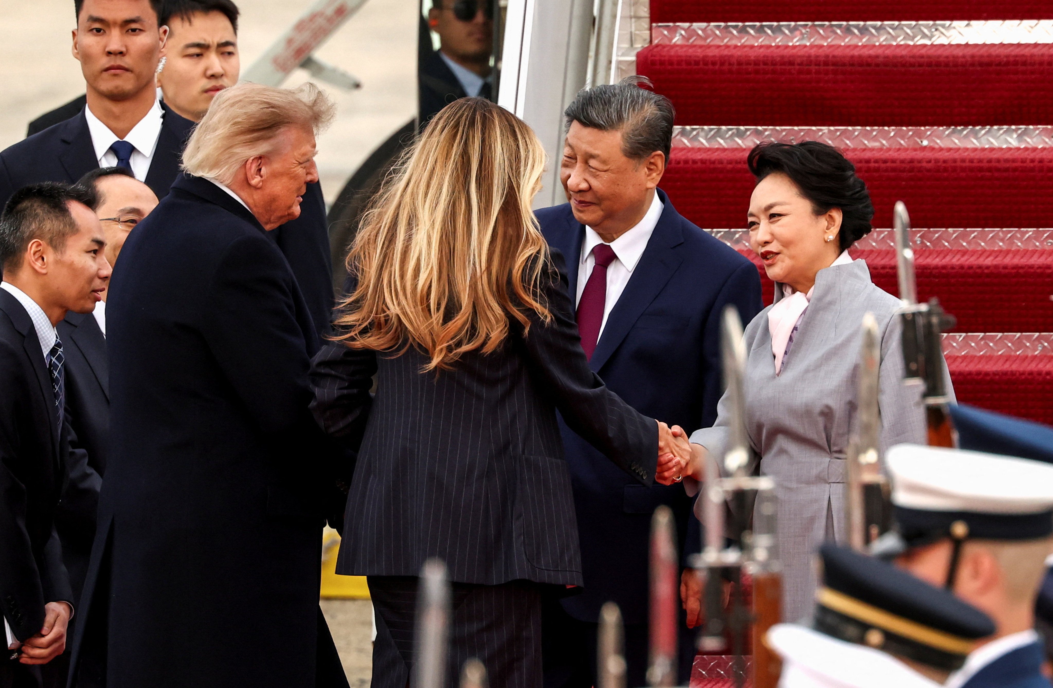 US President Donald Trump and first lady Melania Trump greet Chinese President Xi Jinping and his wife Peng Liyuan upon their arrival at Joint Base Andrews on September 23. Photo: Reuters
