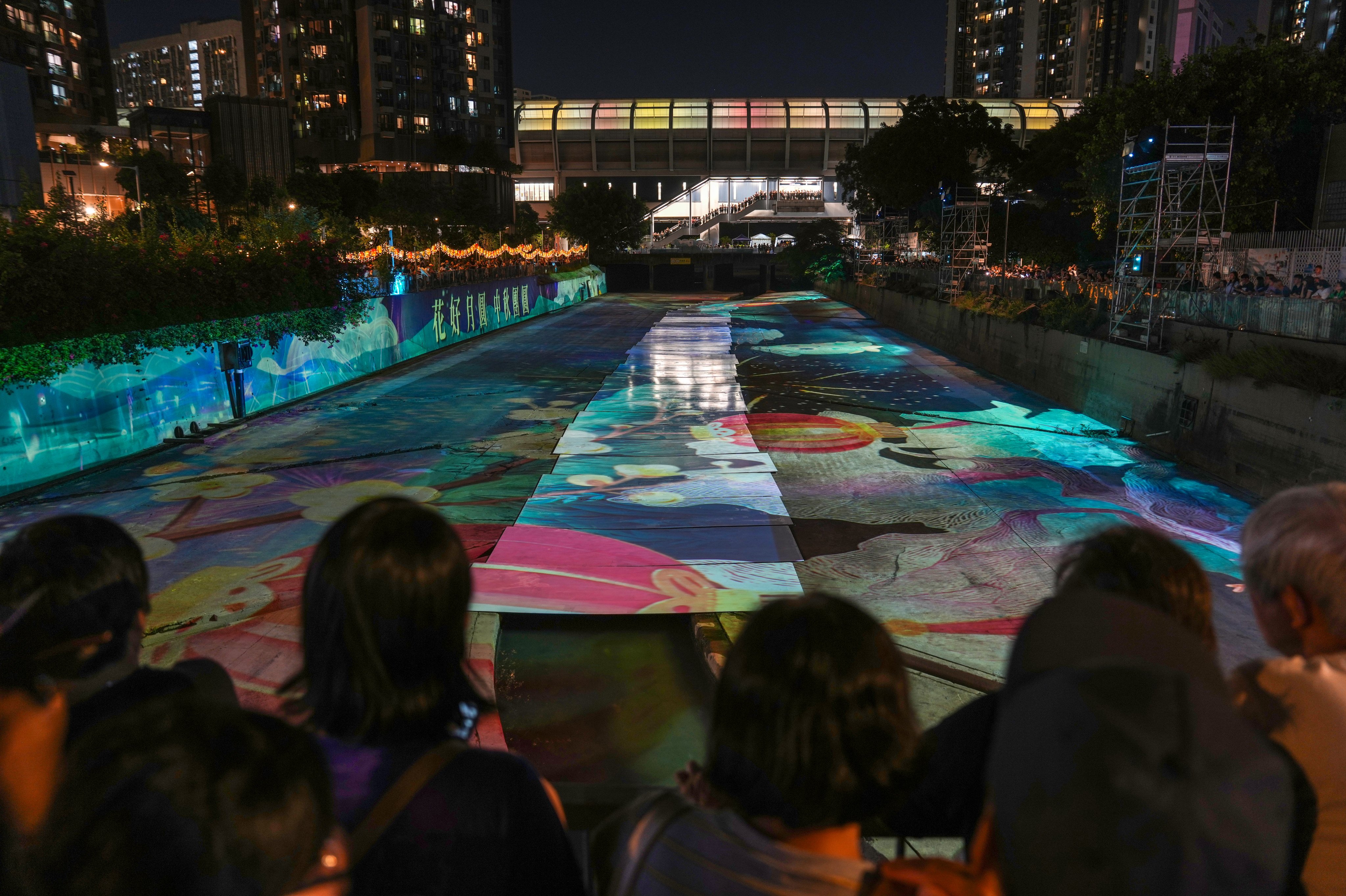 Attendees at the light show at the Yuen Long nullah on Saturday night. Photo: Kit Lai
