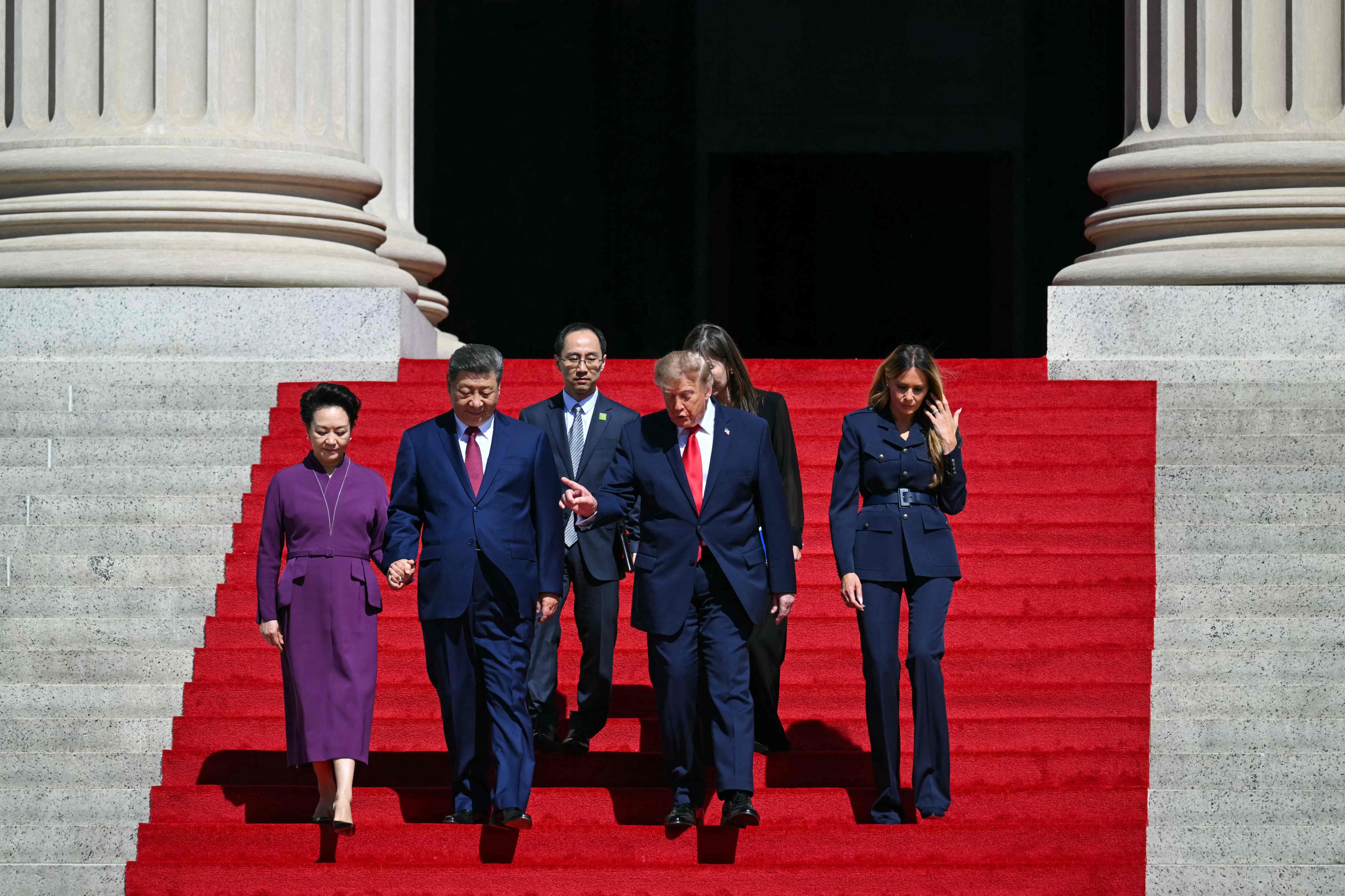 US President Donald Trump, First Lady Melania Trump, China’s President Xi Jinping and his wife, Peng Liyuan, walk down the steps after a visit to the National Archives in Washington, DC on Saturday. Photo: AFP