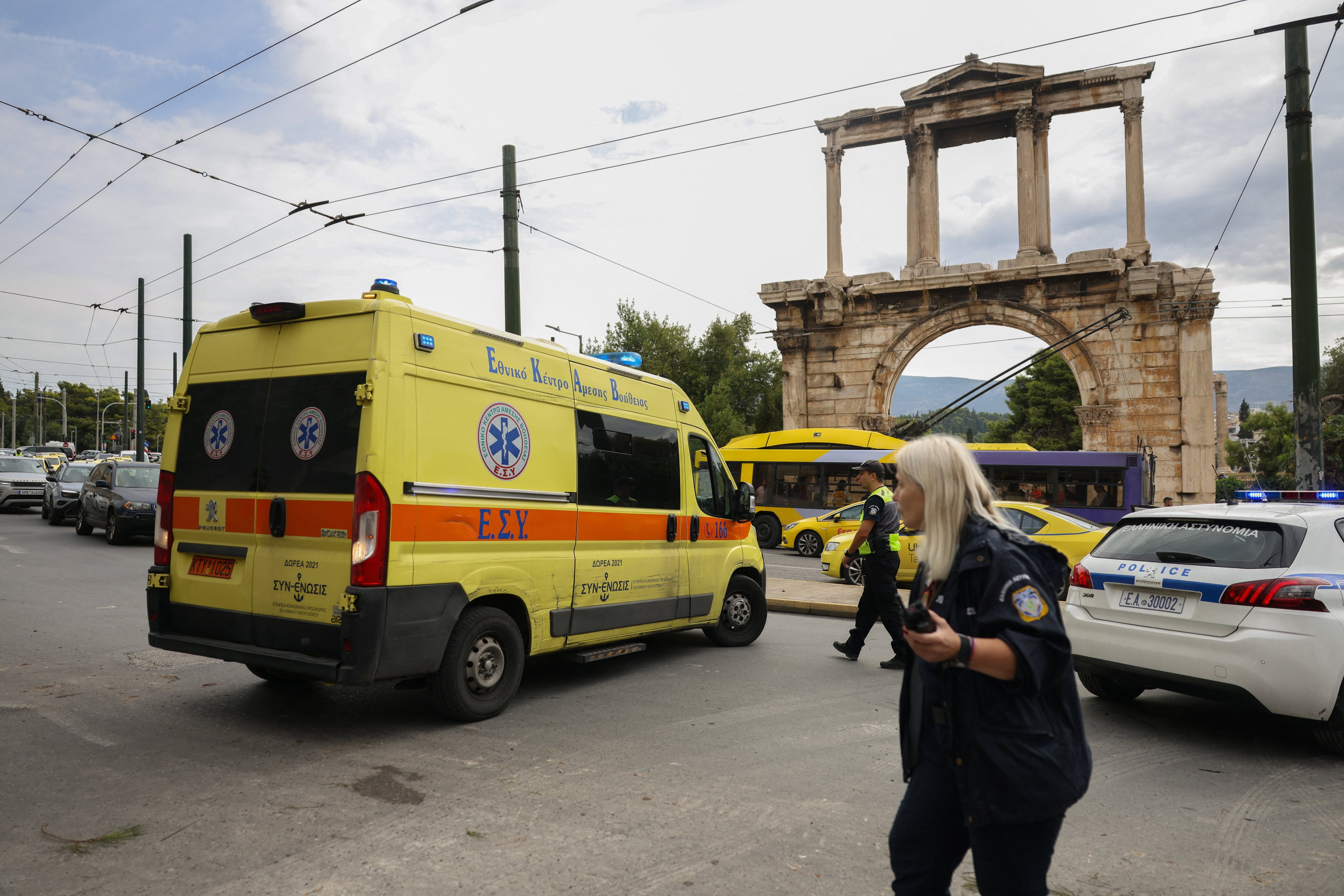 An ambulance transports the body of a person who died after a building partially collapsed following an explosion in the Plaka area, which is popular with tourists, in central Athens, Greece, on Saturday. Photo: Reuters