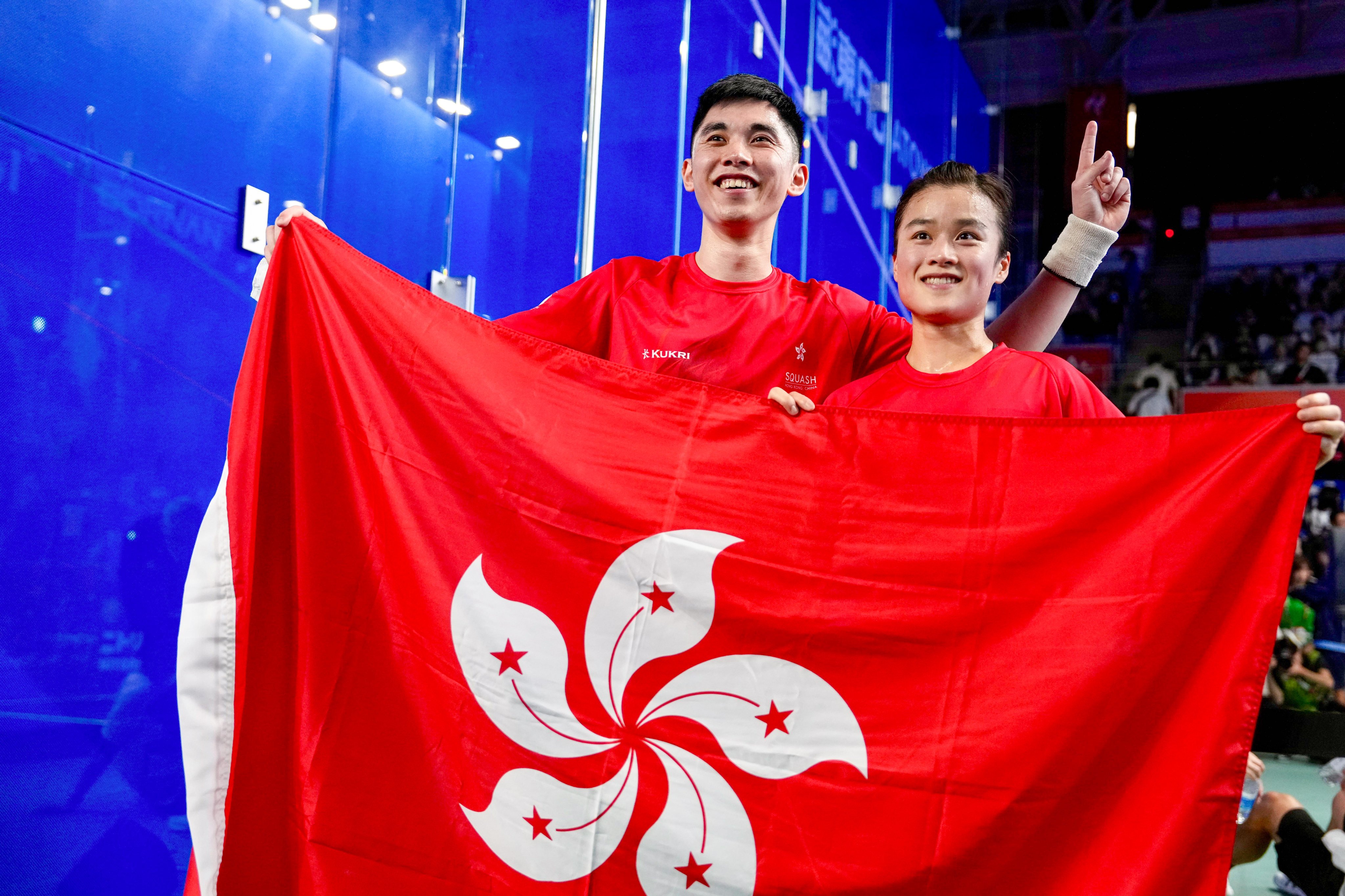 Tang Ming-hong (left) and Lee Ka-yi (red) beat fellow Hongkongers  Toby Tse and Lai Cheuk-nam to the mixed doubles squash title at Nagoya Kinjo Futo Arena on Sunday. Photo: Sam Tsang