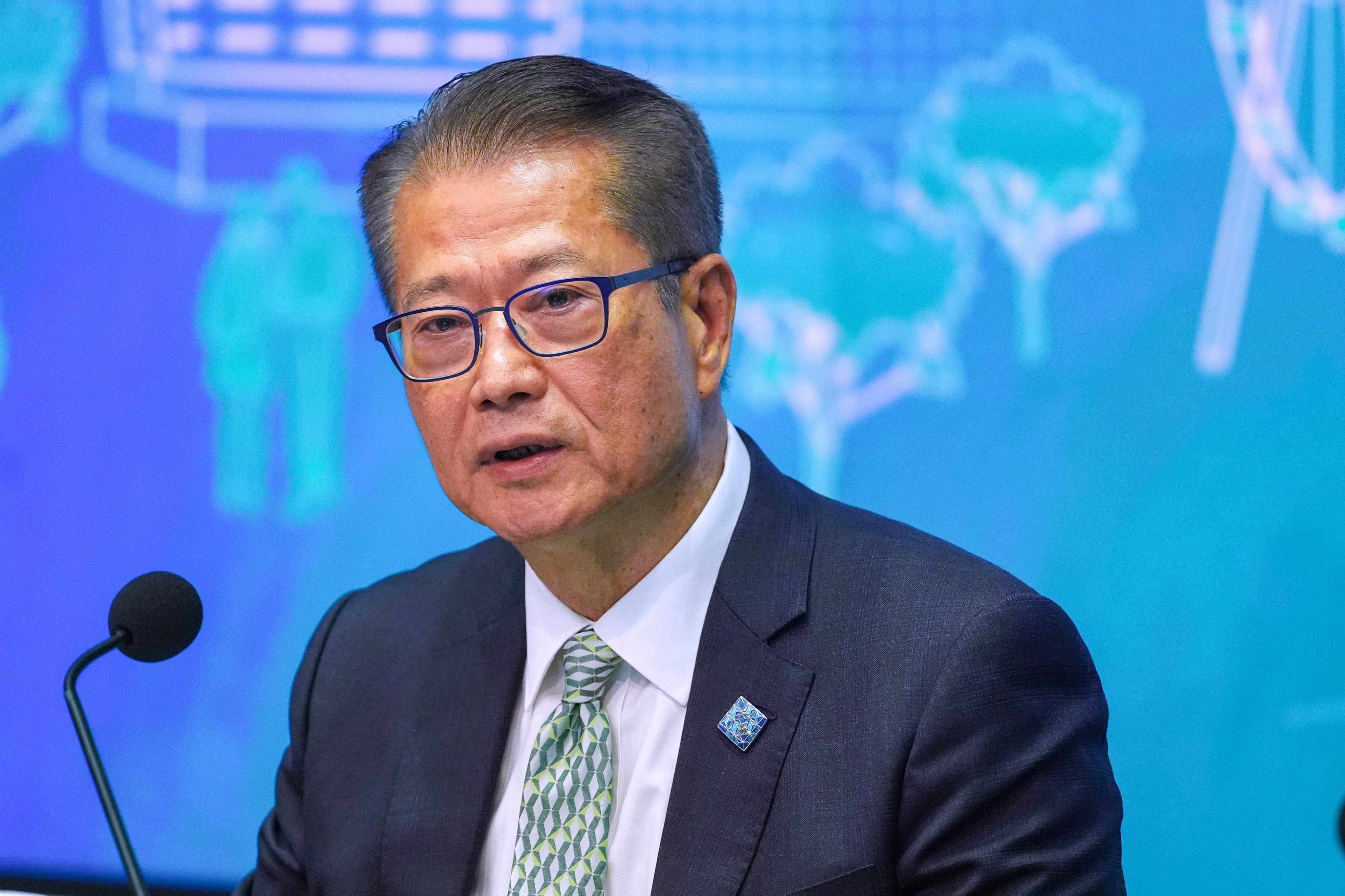 Financial Secretary Paul Chan speaks to the media following the policy address. Photo: Elson Li