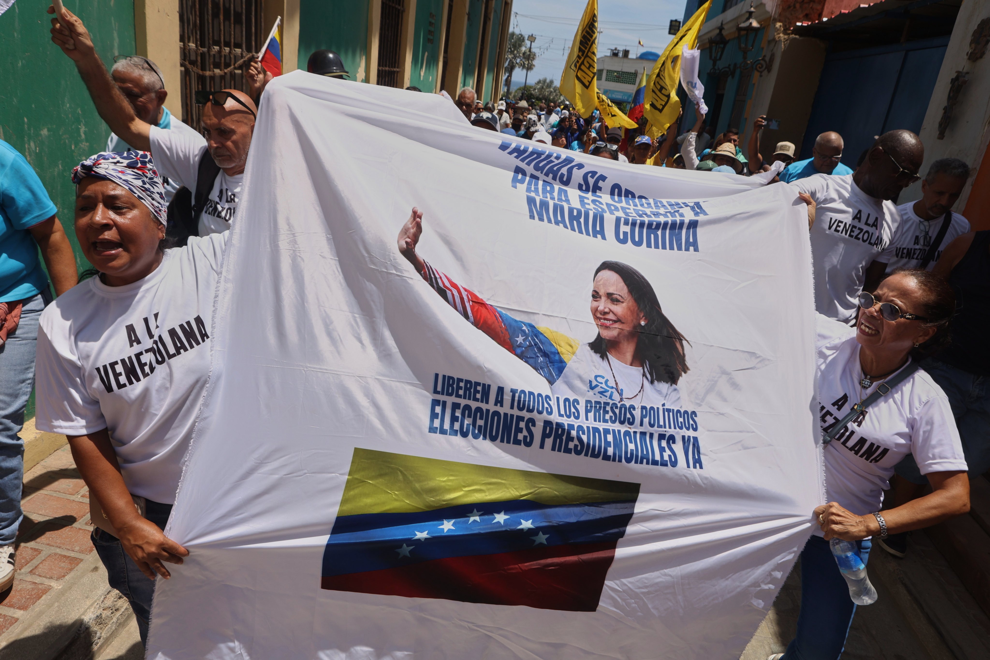 Supporters of opposition leader Maria Corina Machado rally in La Guaira, Venezuela on Sunday. Photo: AP