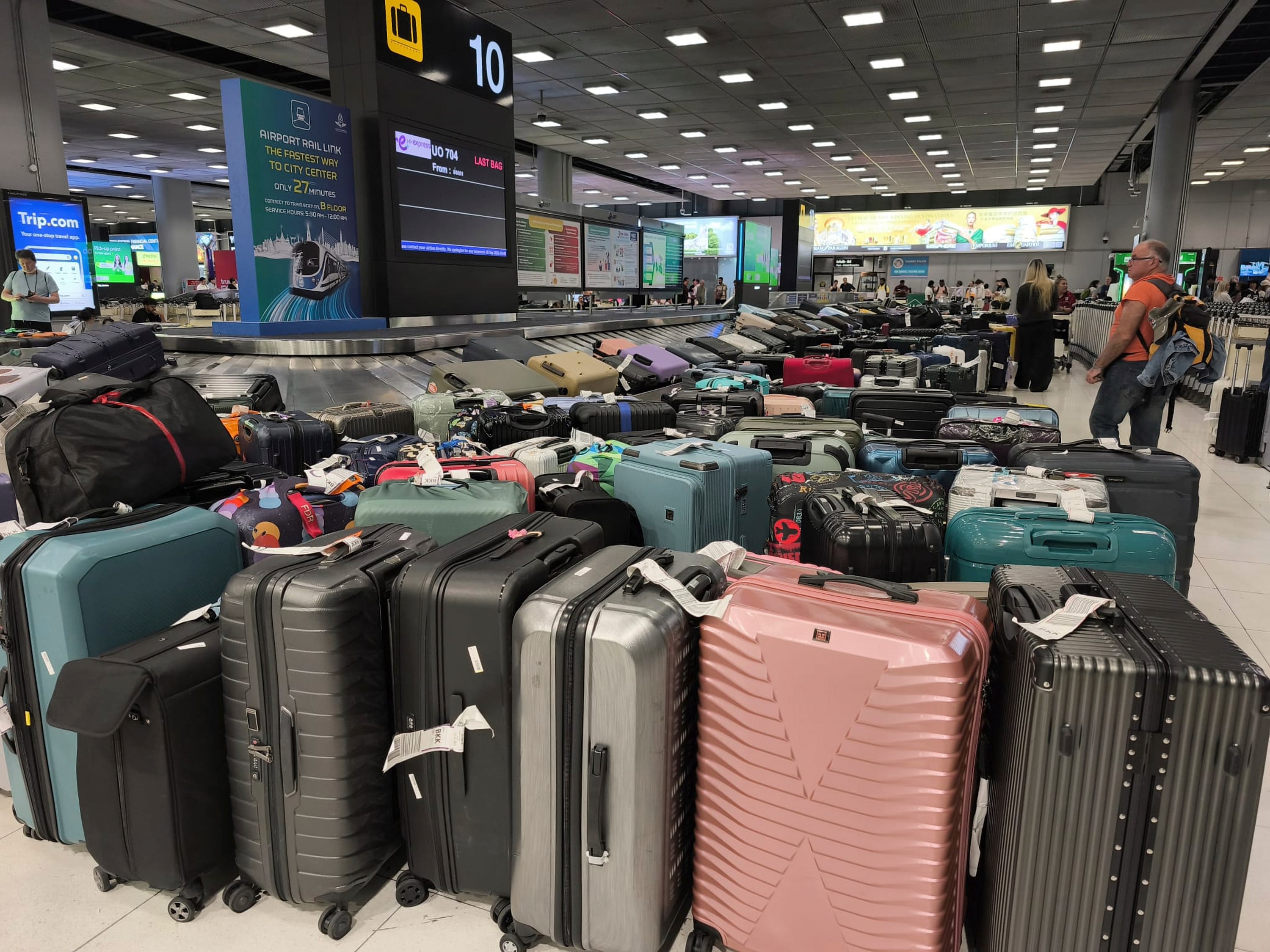 Luggage pile up at Suvarnabhumi Airport. Photo: AP