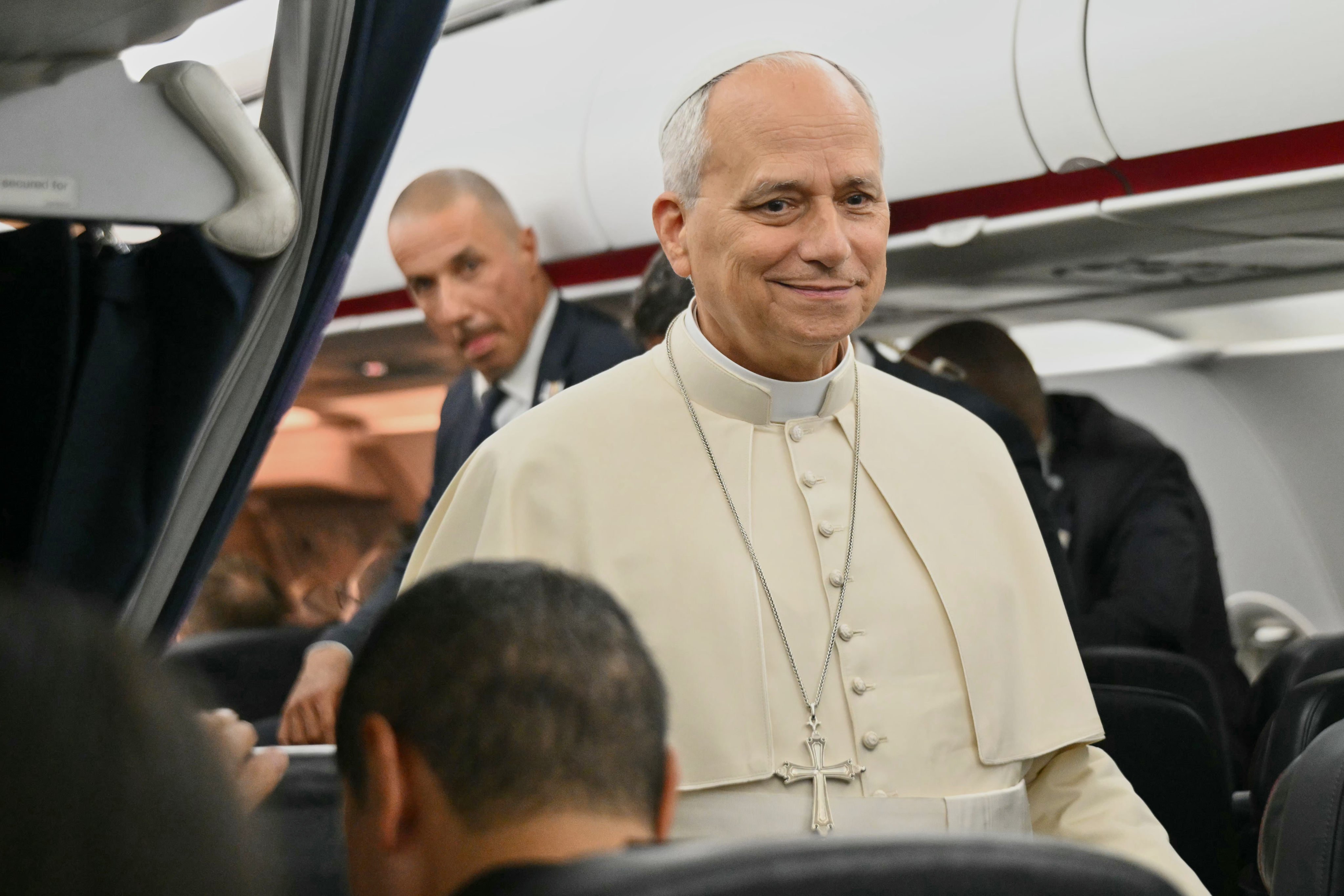 Pope Leo speaks to journalists aboard the flight from Metz, France, to Rome on Monday. Photo: Pool Photo via AP