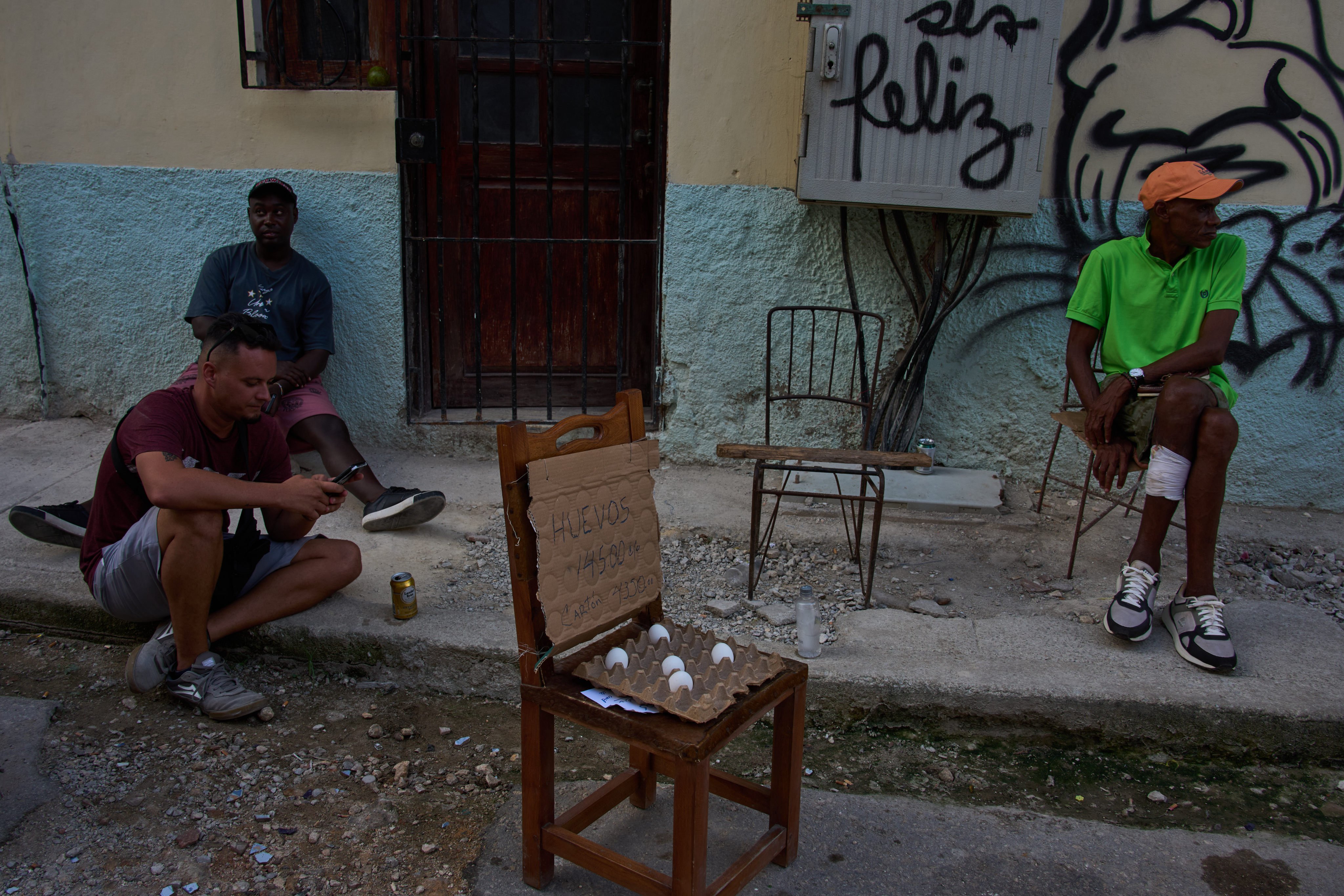People gather on a street during a blackout in Havana earlier this month. Photo: AP