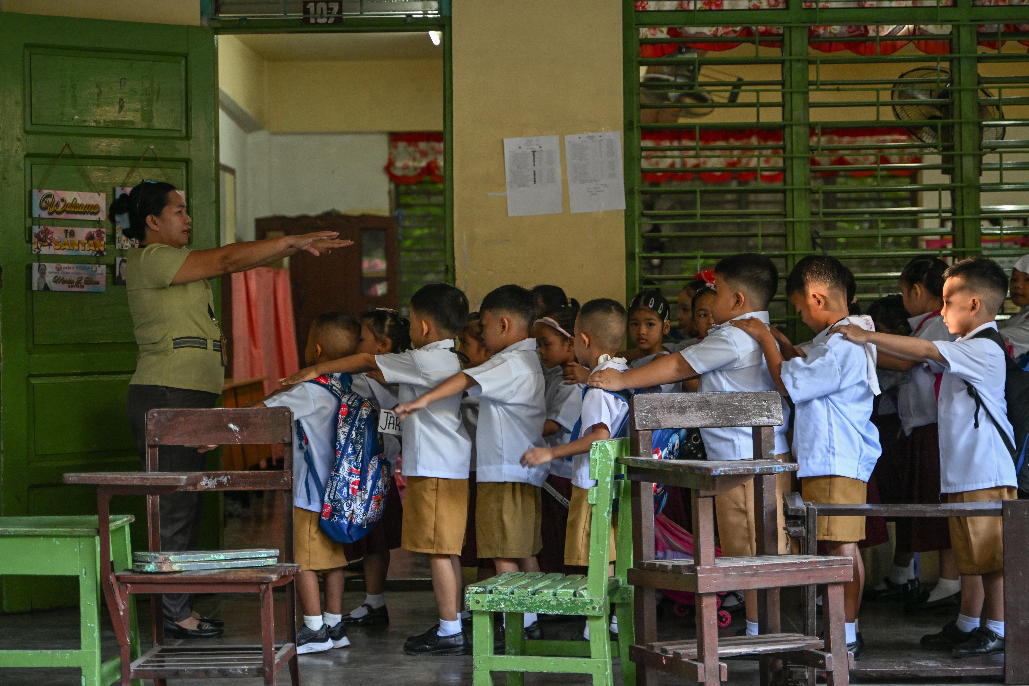A teacher instructs students as classes open for the new school year at a junior school in Manila, the Philippines, in June 2025. Photo: AFP