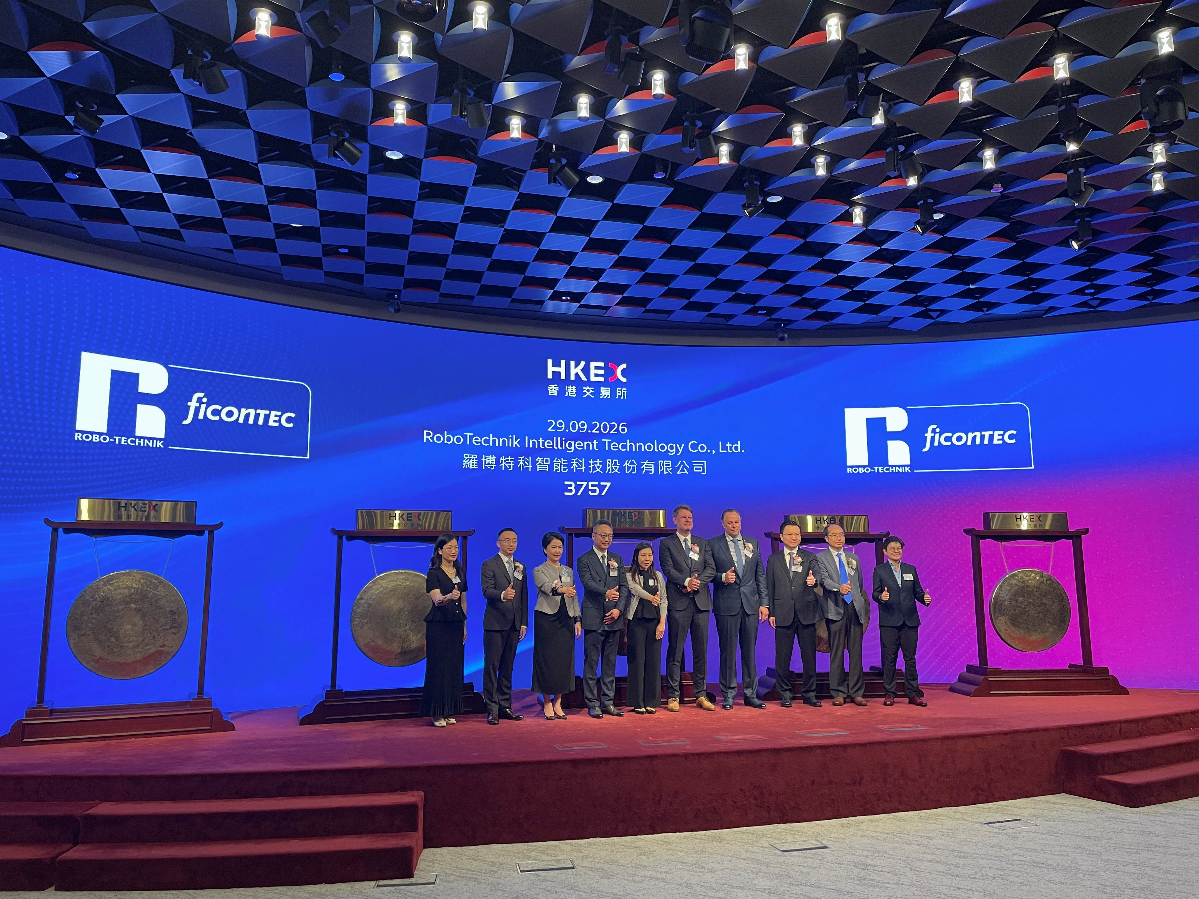 Executives and guests attend the listing ceremony of RoboTechnik Intelligent Technology the Hong Kong stock exchange on Tuesday. Photo: Reuters