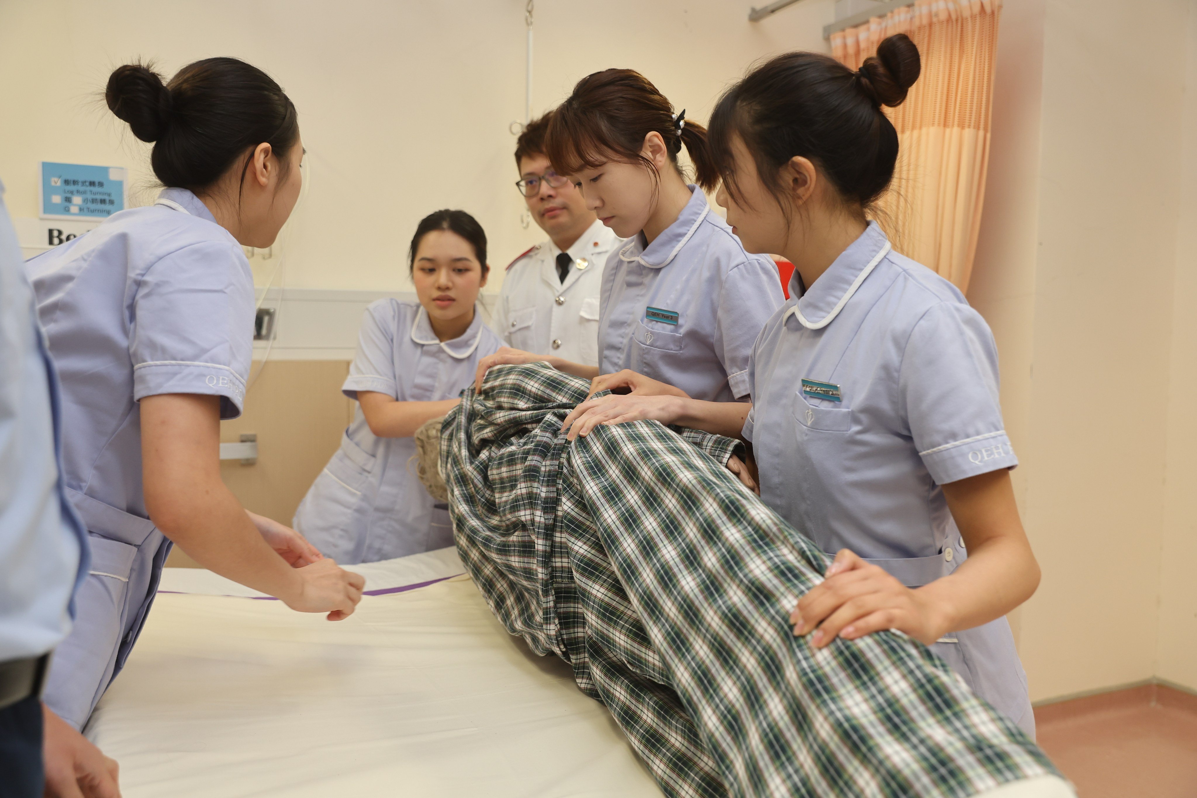 Nursing students take part in a demonstration during a press conference on the joint recruitment drive by Hospital Authority-run nursing schools. Photo: Edmond So