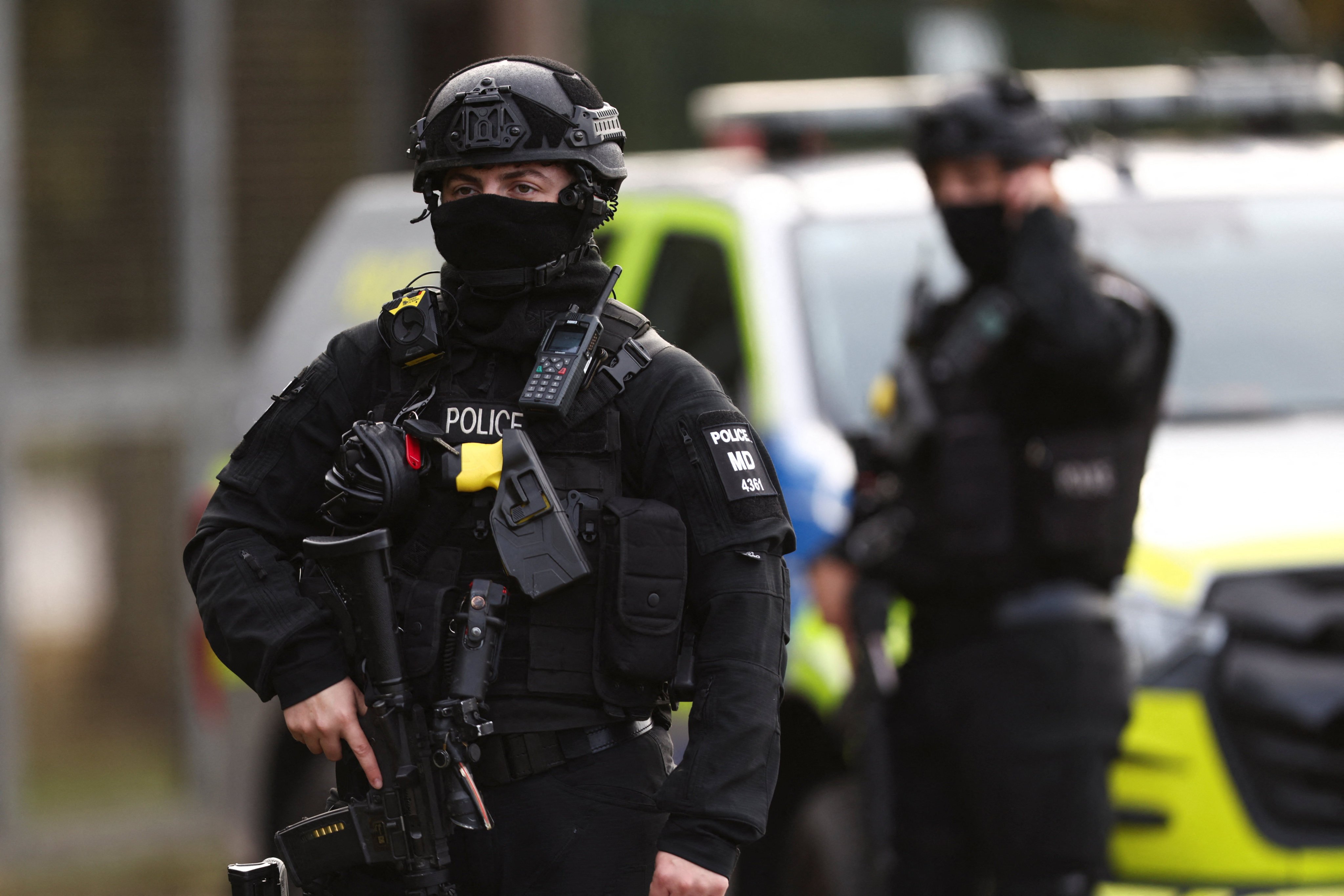 Armed police guard a road outside the perimeter of RAF Fairford airbase. Photo: Reuters