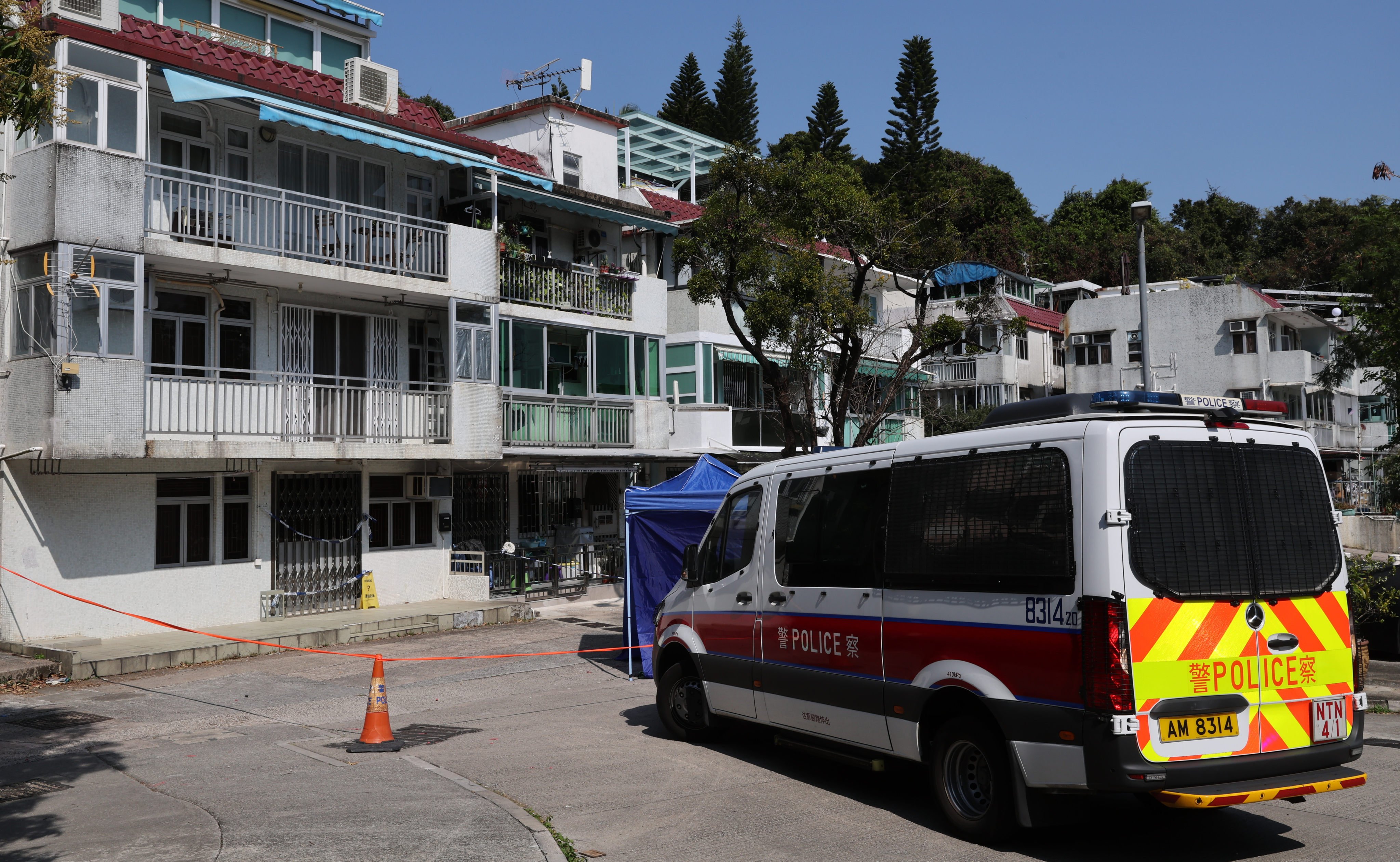Police officers cordon off the crime scene in Lung Mei Village in Tai Po in 2023. Photo: Yik Yeung-man