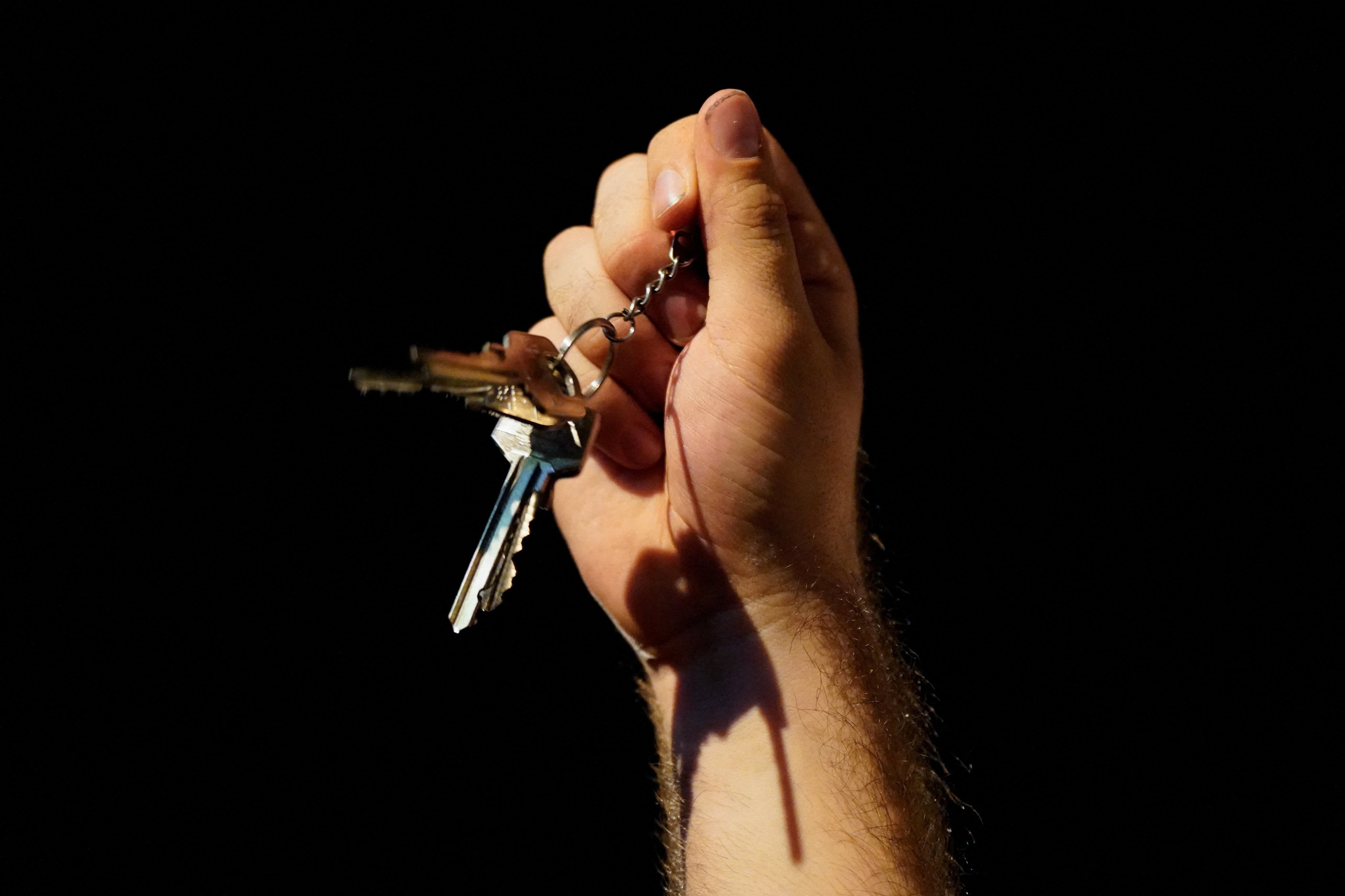 A demonstrator holds keys as people protest in Madrid. Photo: Reuters