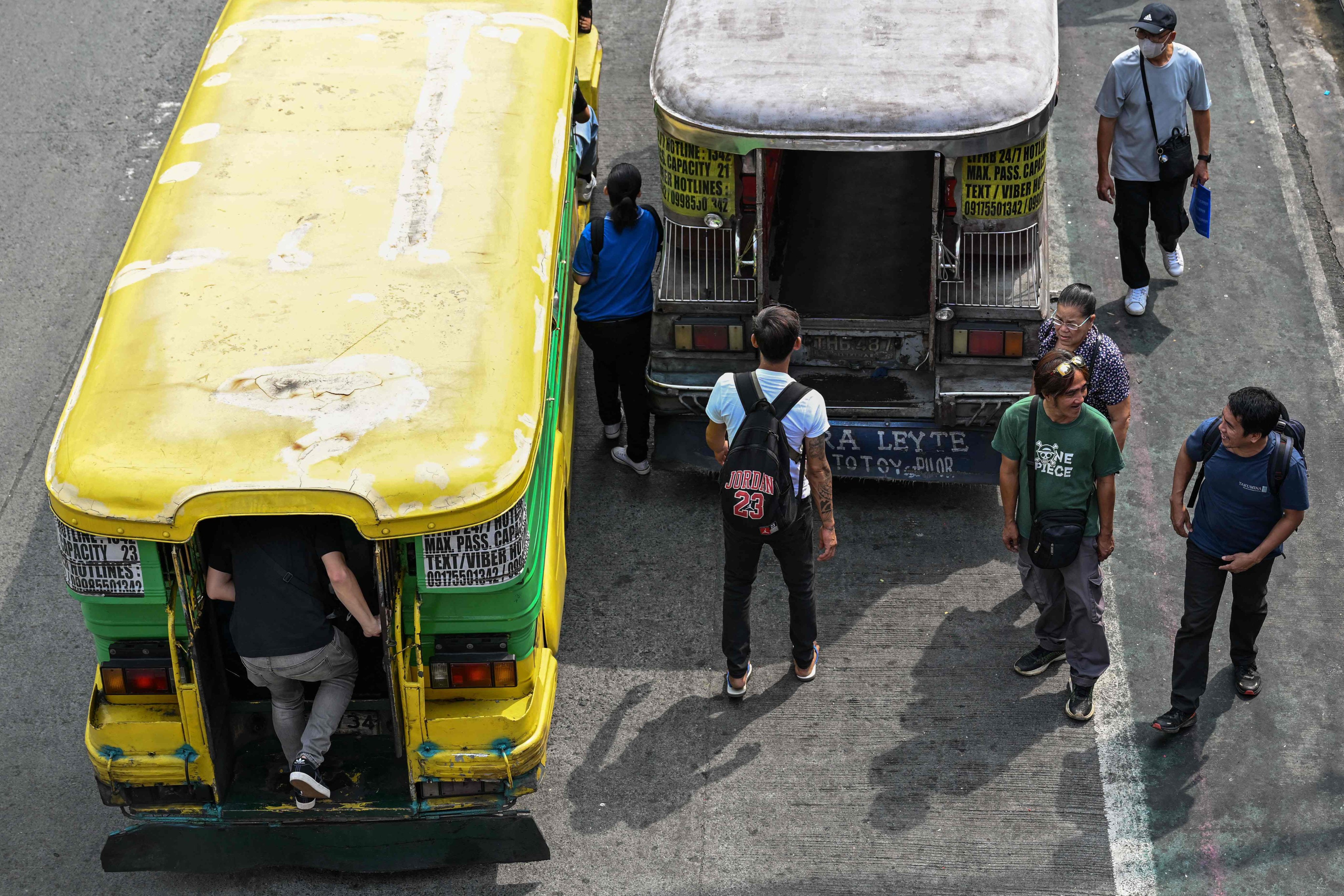 Commuters embark on a jeepney in Pasay City, Metro Manila, the Philippines, on Monday. Photo: AFP