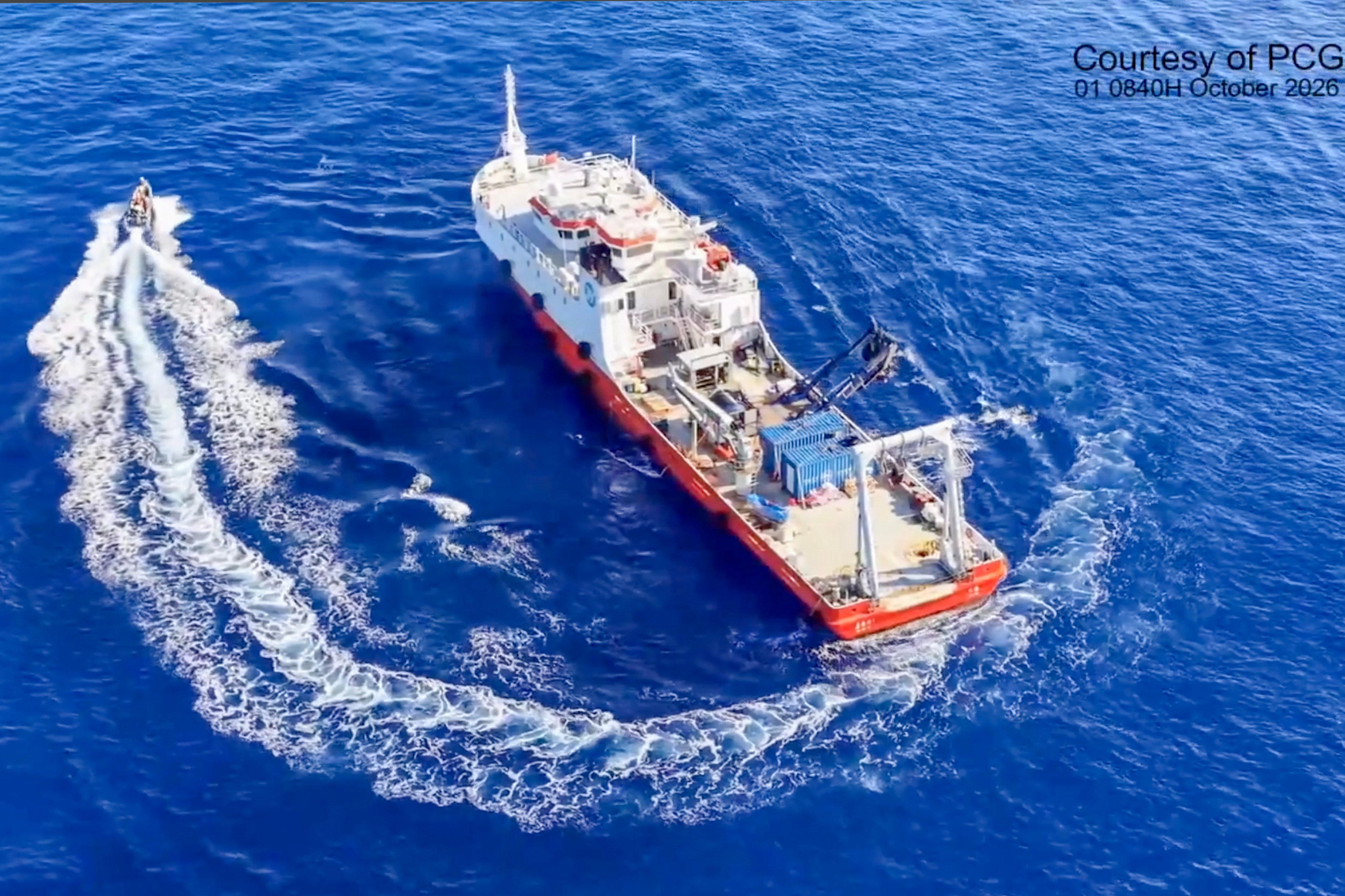 A Philippine inflatable boat circles the Jia Hai Ke 7, a Chinese civilian research vessel that has spent more than a week conducting operations in waters off the Philippines’ Batanes Islands. Photo: X.com/Jay Tarriela