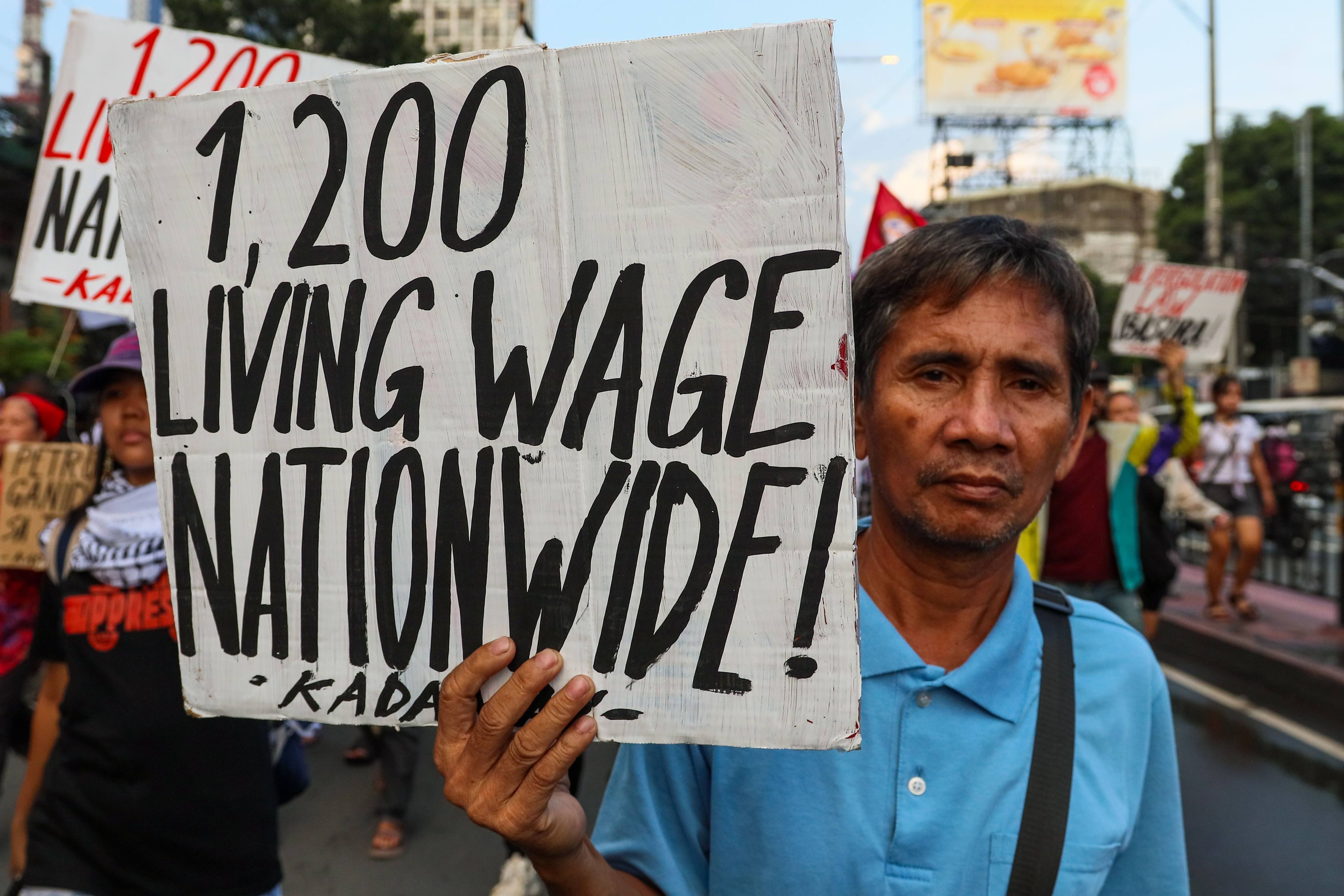 Jeepney drivers, transport workers and supporters rally through Metro Manila, the Philippines, during the second day of a transport strike over rising fuel prices and operating costs on Wednesday. Photo: dpa