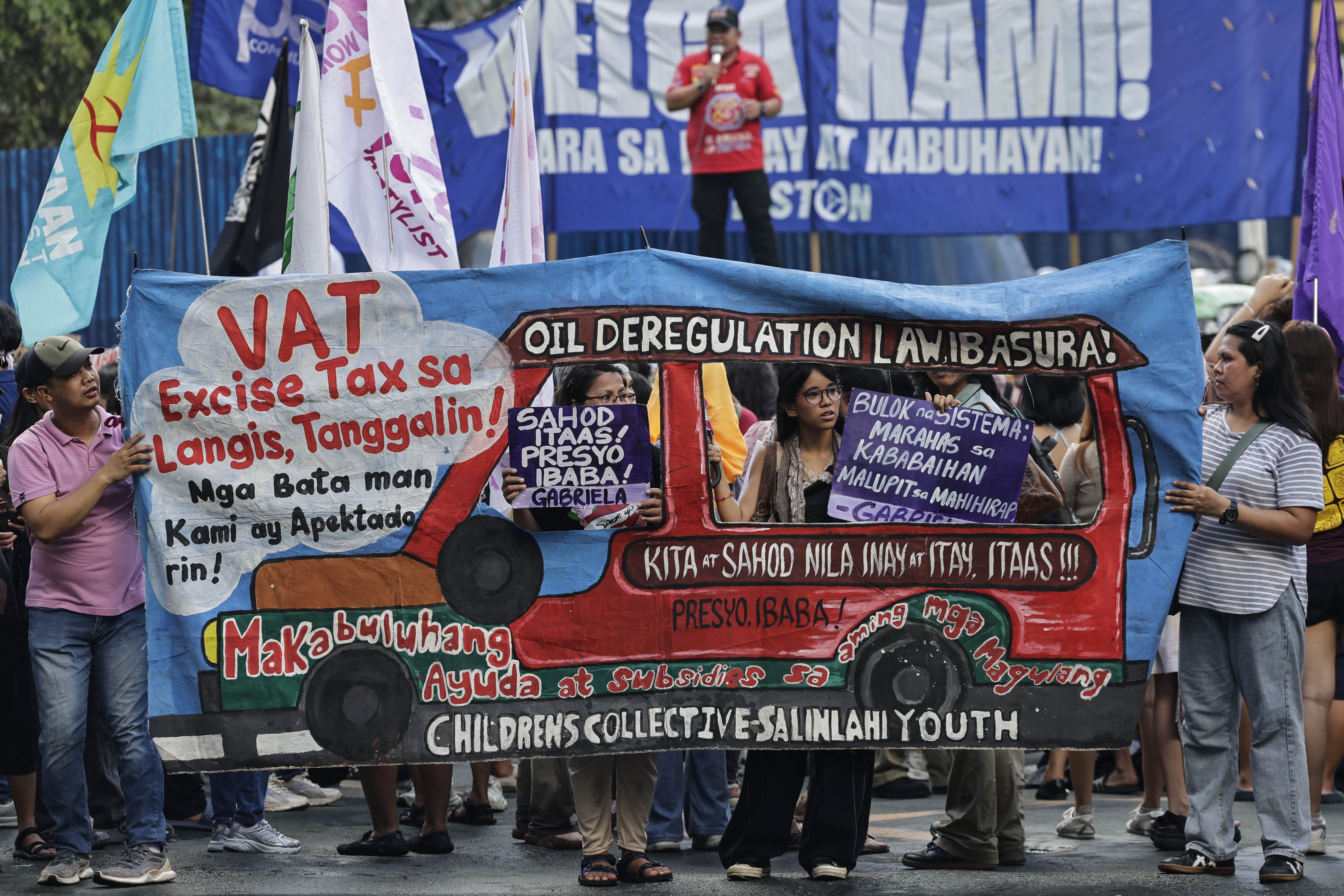Protesters opposed to fuel price increases display a caricature of a jeepney, or local minibus, during a rally in Manila, the Philippines, on Wednesday. Photo: EPA