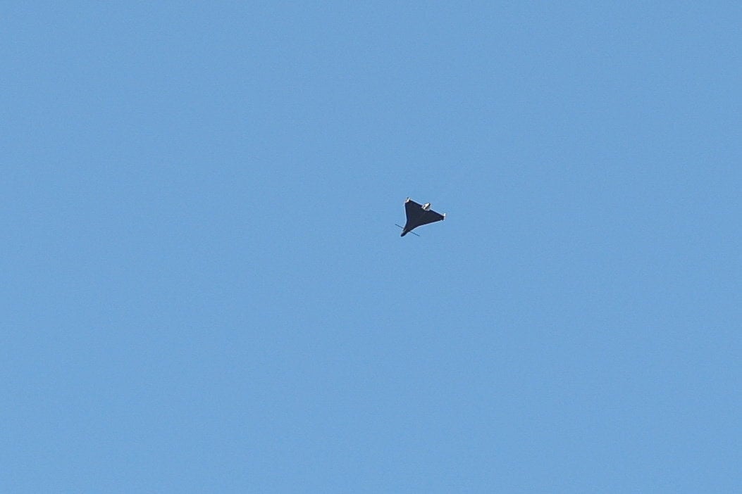 A Russian kamikaze jet drone flies over a village in the Kyiv region. Photo: Reuters