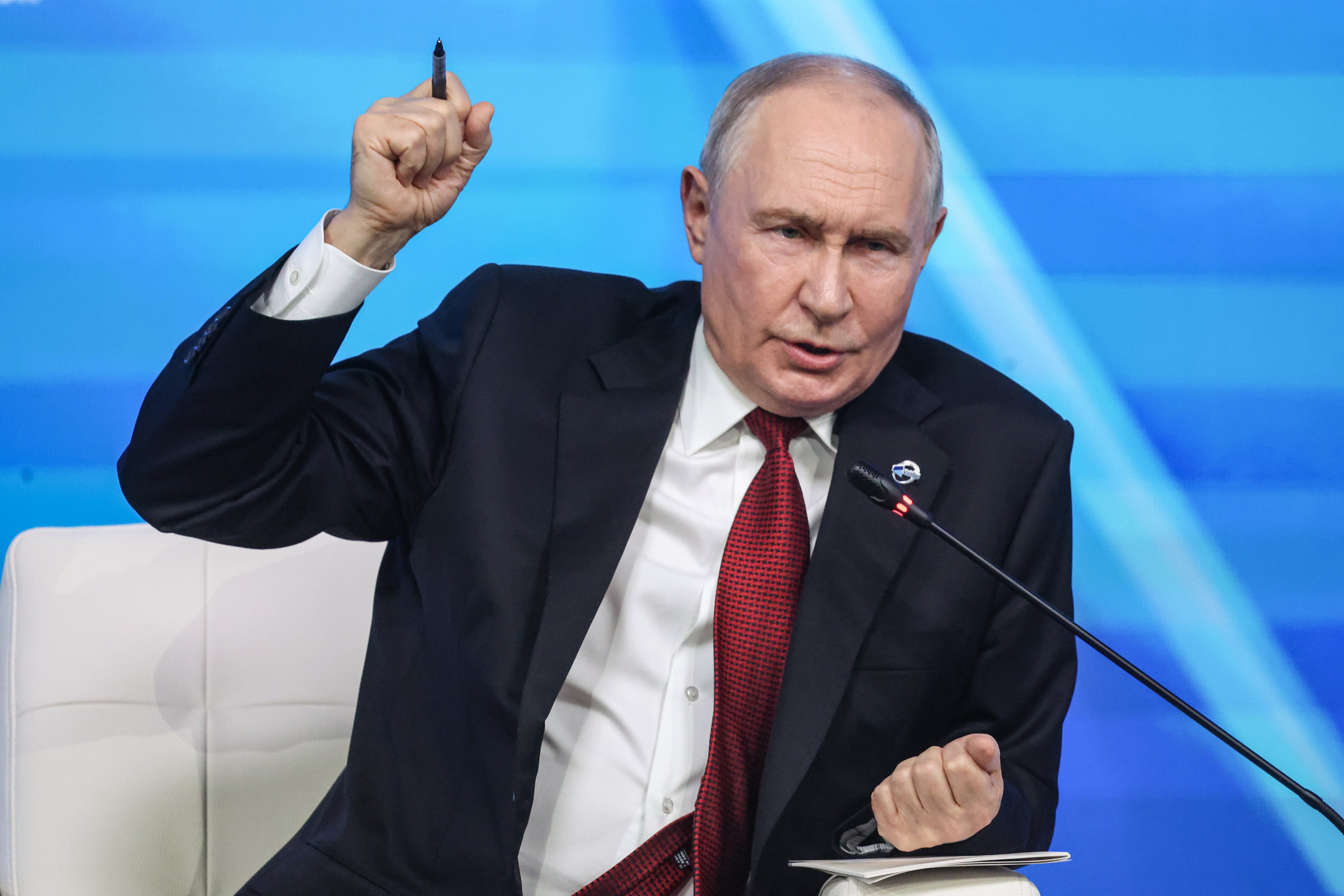 Russian President Vladimir Putin attends a plenary session in Moscow on Thursday. Photo: EPA