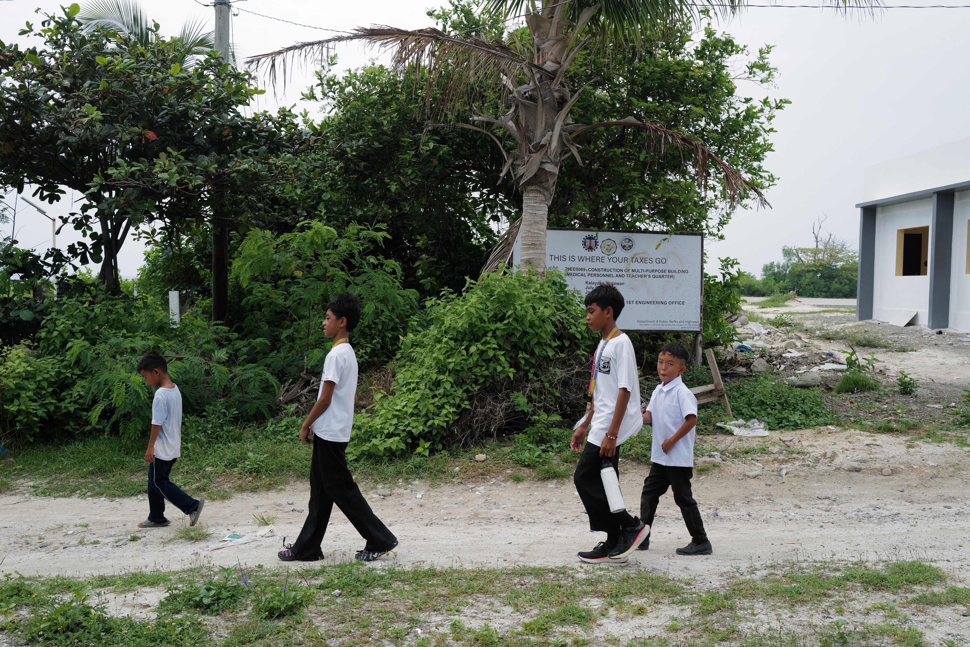 Primary school students head home in Thitu. Photo: Jeoffrey Maitem