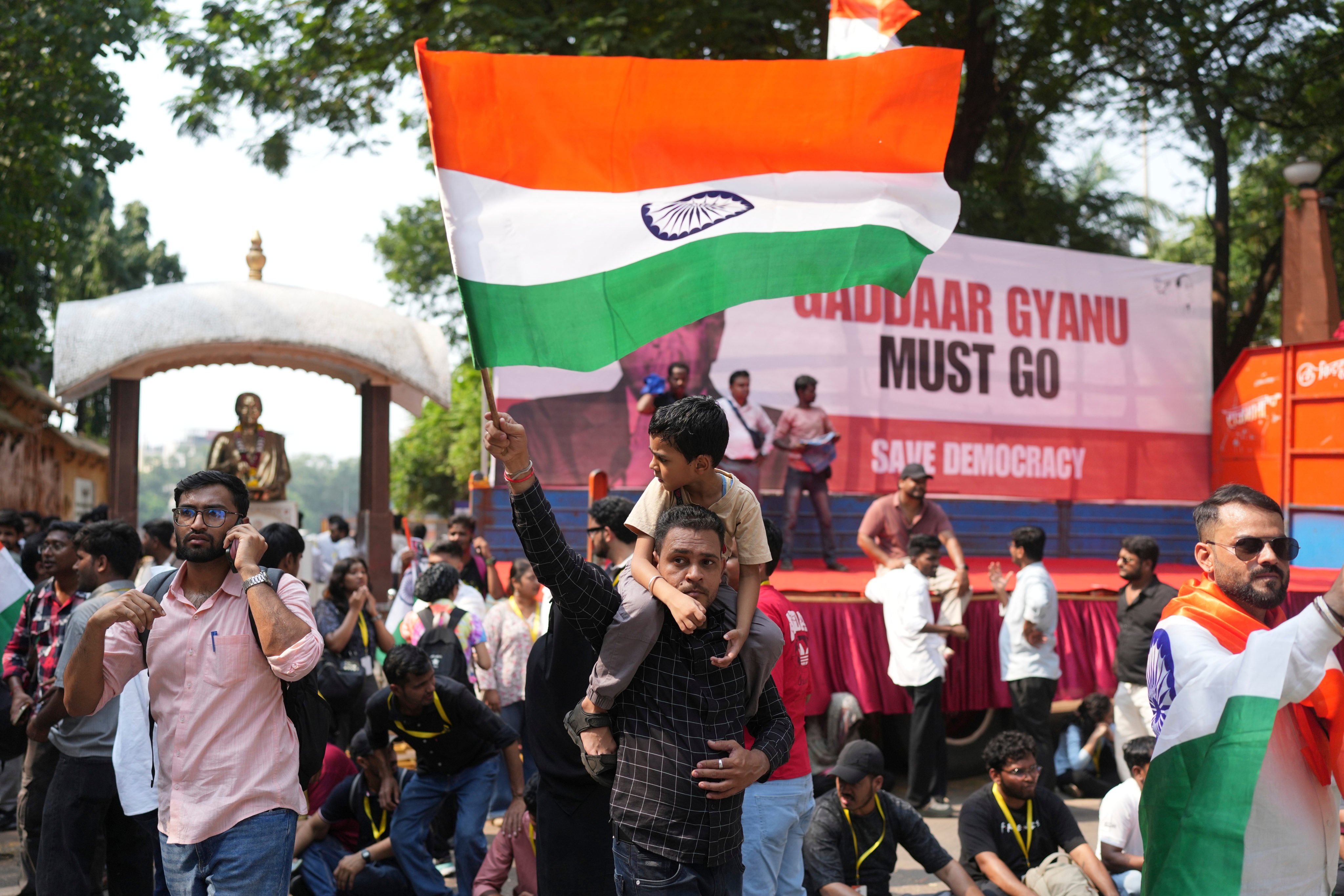 A supporter of the Cockroach Janta Party waves a national flag at a protest against chief election commissioner Gyanesh Kumar in Mumbai on Friday. Photo: AP