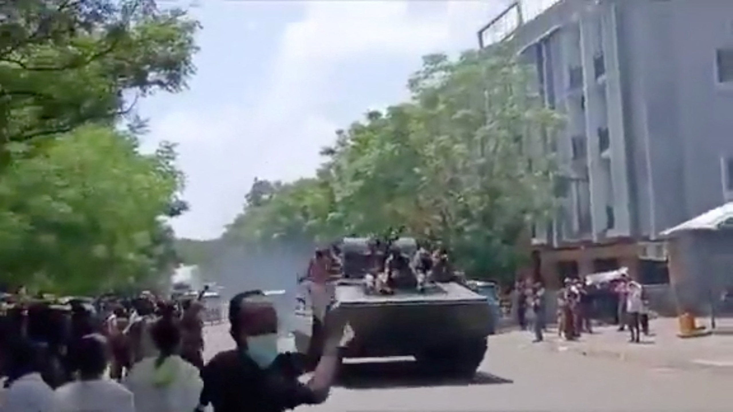 Armed men on armoured vehicles drive through Alamata, Ethiopia, in a photo obtained from social media on September 28. Photo: Social media via Reuters