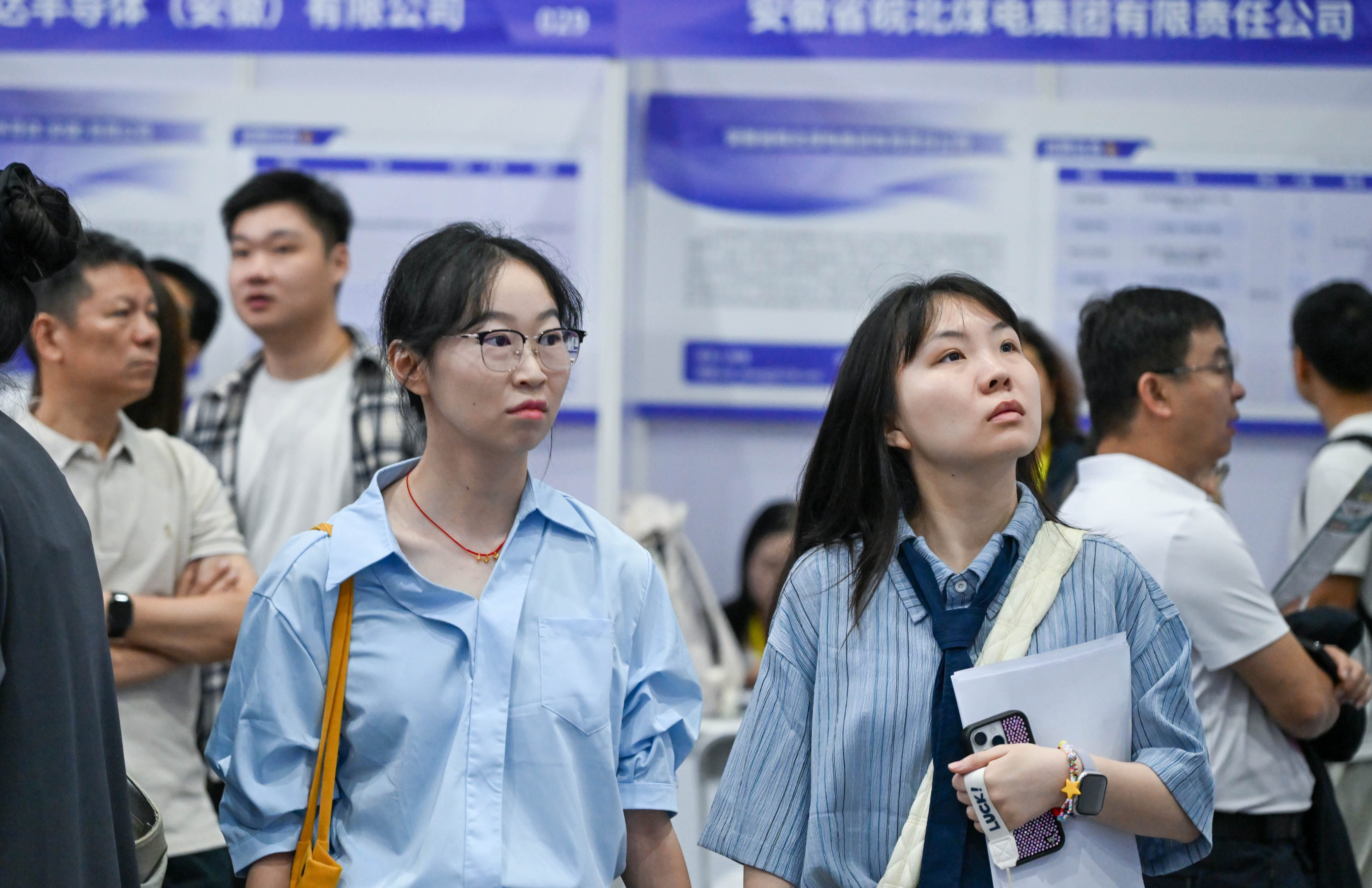 Jobseekers check offerings at a job fair for university graduates and high-level talent in Nanjing, Jiangsu province, on September 20. Photo: Xinhua