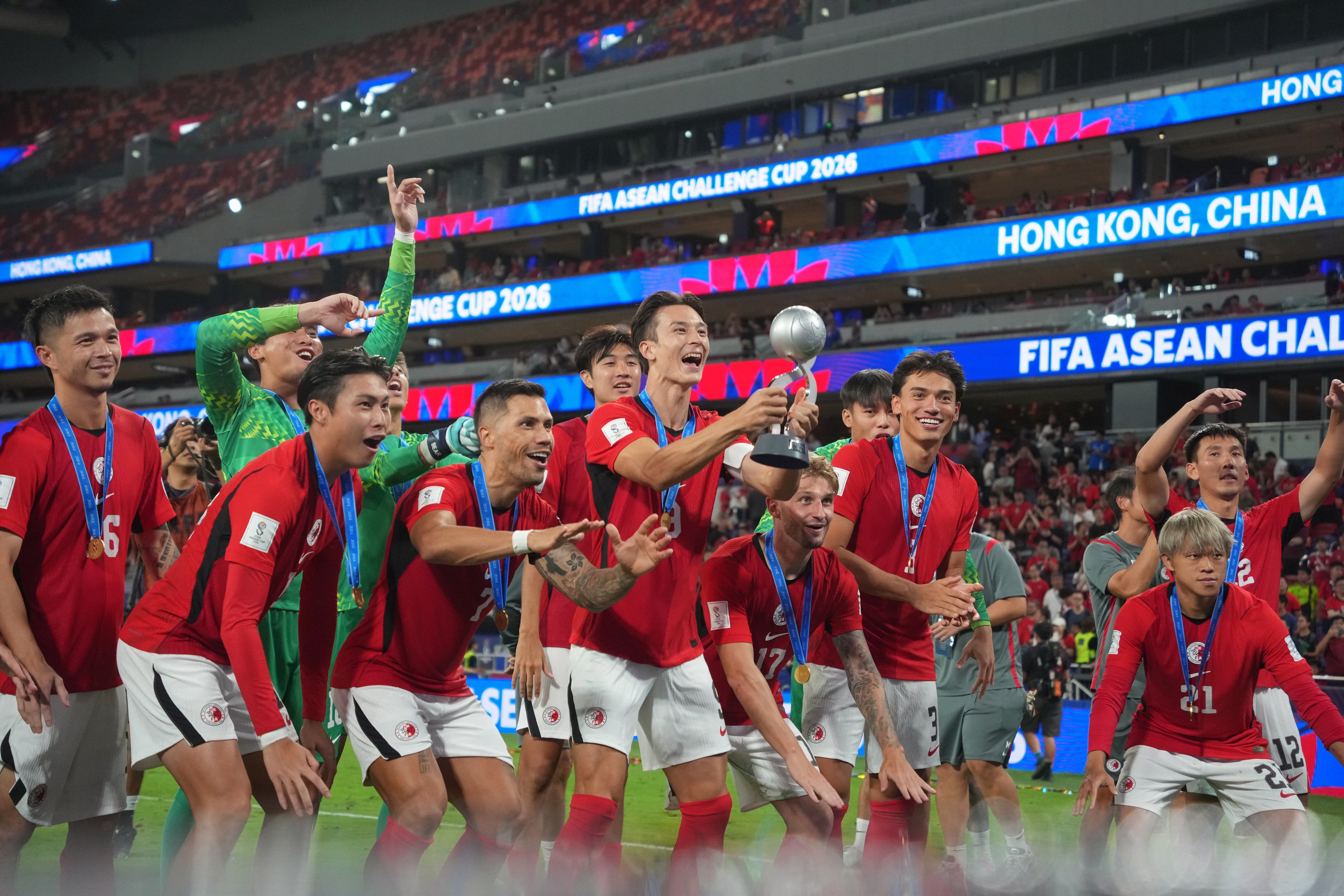 Hong Kong’s players celebrate their Fifa Asean Challenge Cup triumph but they could soon have a glass ceiling imposed above their heads. Photo: Kit Lai