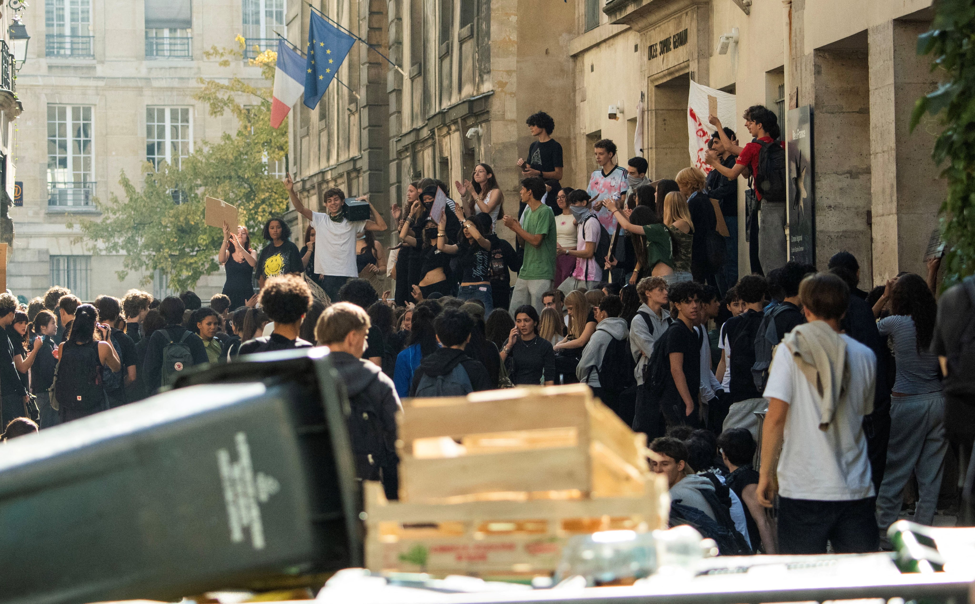 French high school students gather outside the Lycee Sophie Germain high school as part of nationwide protests over overcrowded classrooms, teacher shortages, and dilapidated school buildings, in Paris on Monday. Photo: Reuters