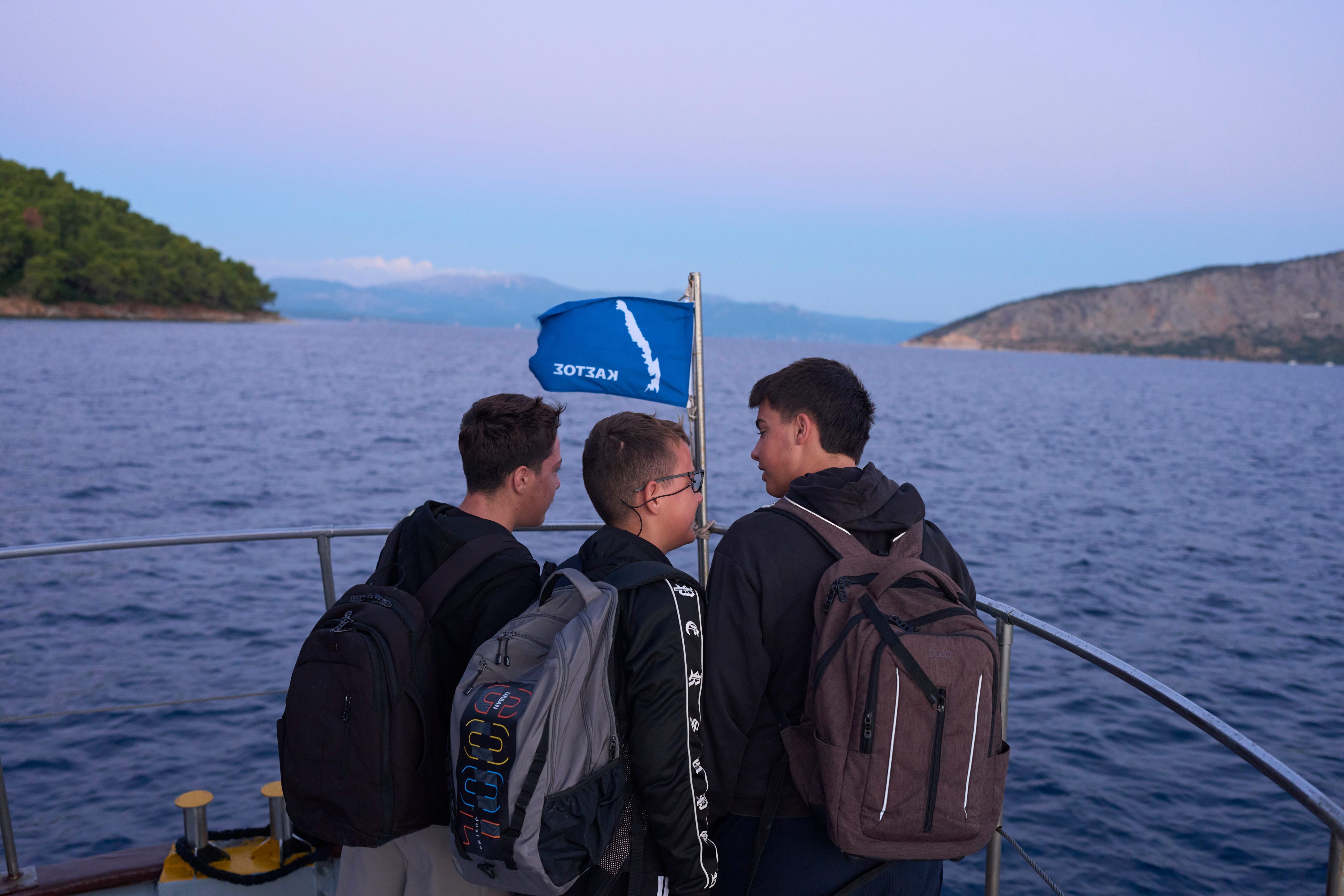 Middle and high school students travel by passenger boat across the Ionian Sea from the island of Kalamos, where they live, to schools in the mainland town of Mytikas, western Greece, in September. Photo: AP