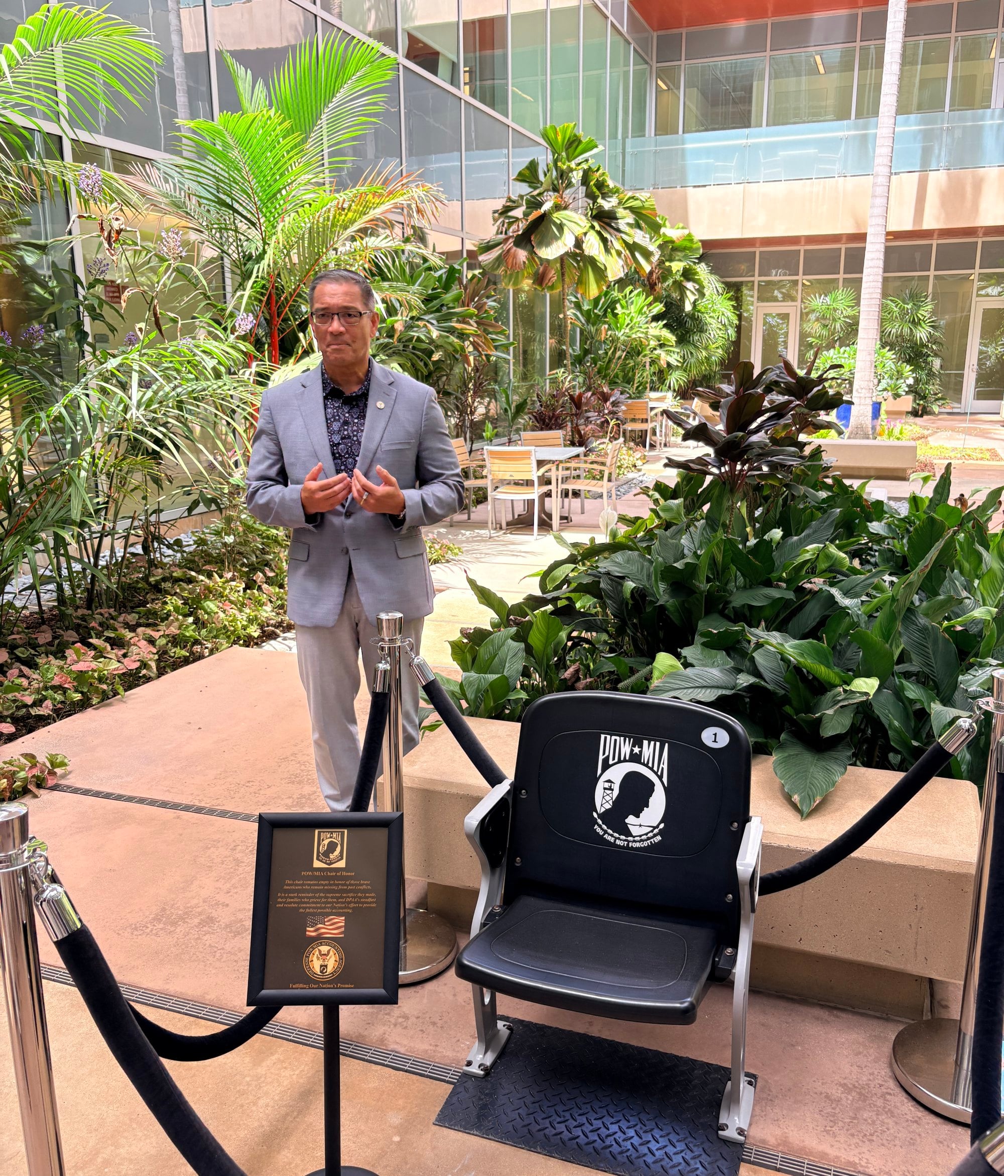 John Figuerres, a senior operations officer at the Defense POW/MIA Accounting Agency, stands beside an empty chair honouring US prisoners of war and those missing in action at the agency’s headquarters in Hawaii. Photo: Teresa Frontado John Figuerres, a senior operations officer at the Defense POW/MIA Accounting Agency, stands beside an empty chair honouring US prisoners of war and those missing in action at the agency’s headquarters in Hawaii. Photo: Teresa Frontado