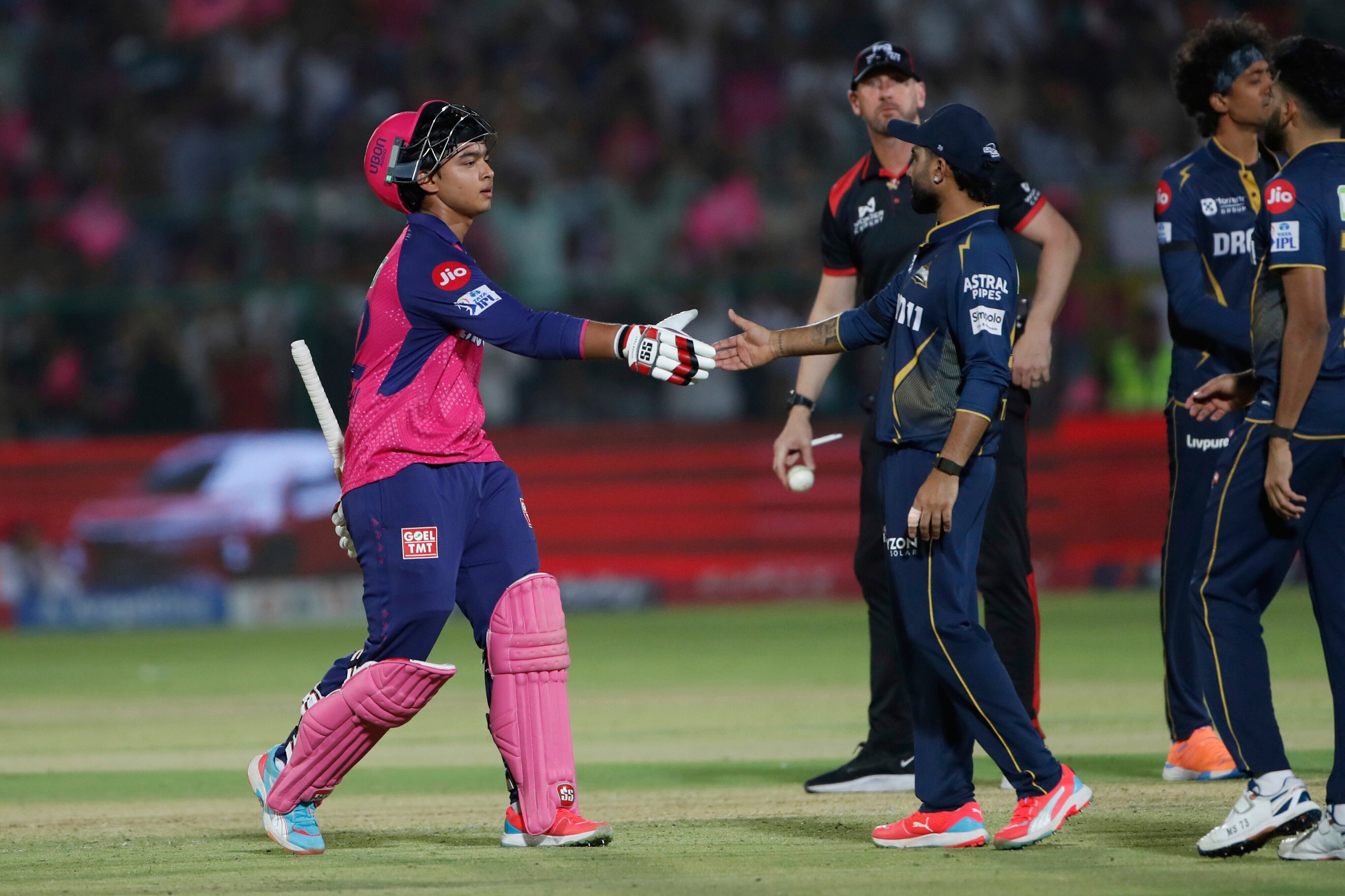 Rahul Tewatia of Gujarat Titans congratulates Rajasthan Royals’ Vaibhav Suryavanshi (left) on a fine innings during the teams’ Indian Premier League match last year. Photo: AP Photo