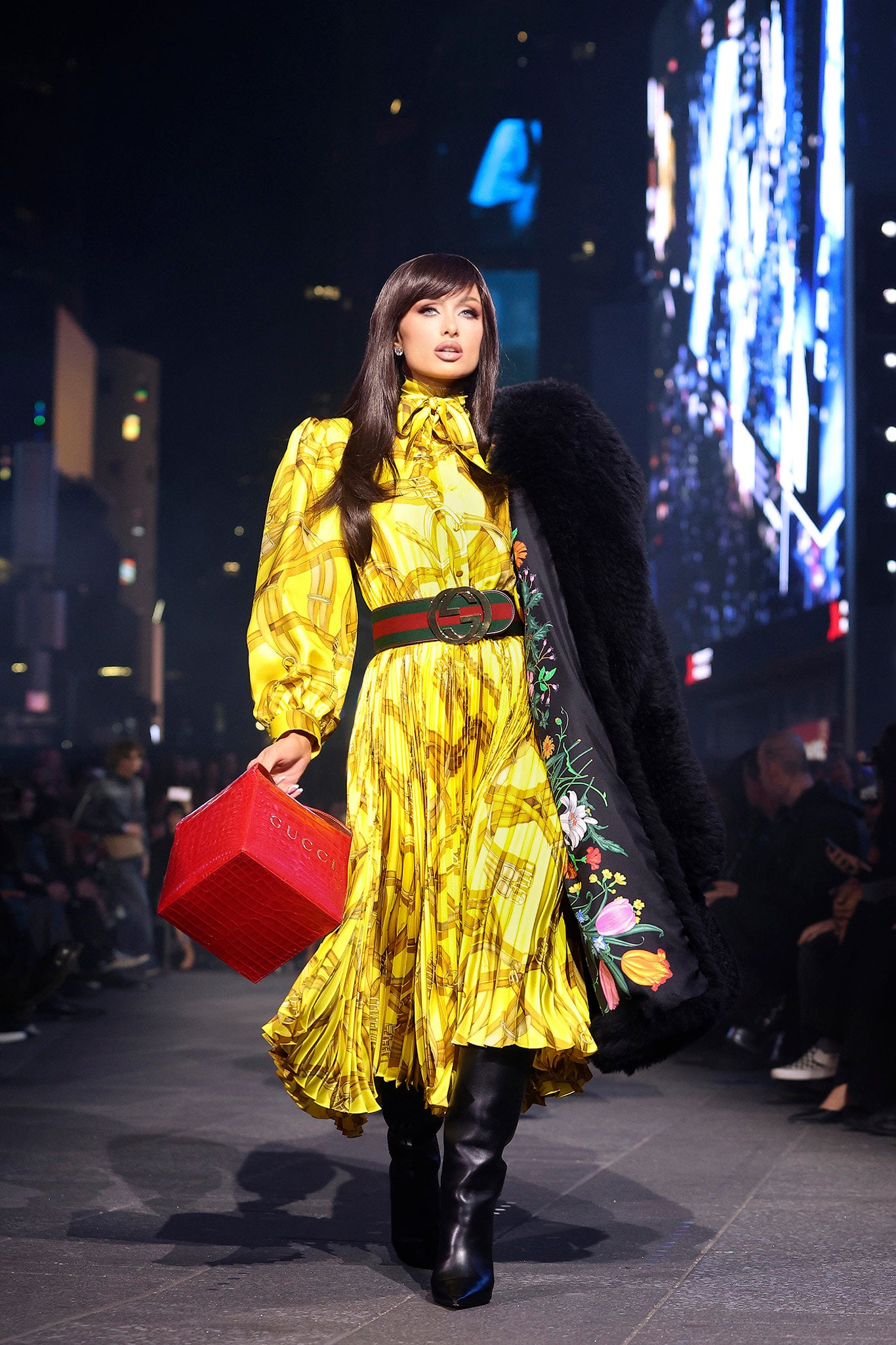 Paris Hilton shimmers in the Gucci cruise 2027 show in Times Square, New York. Photo: Handout