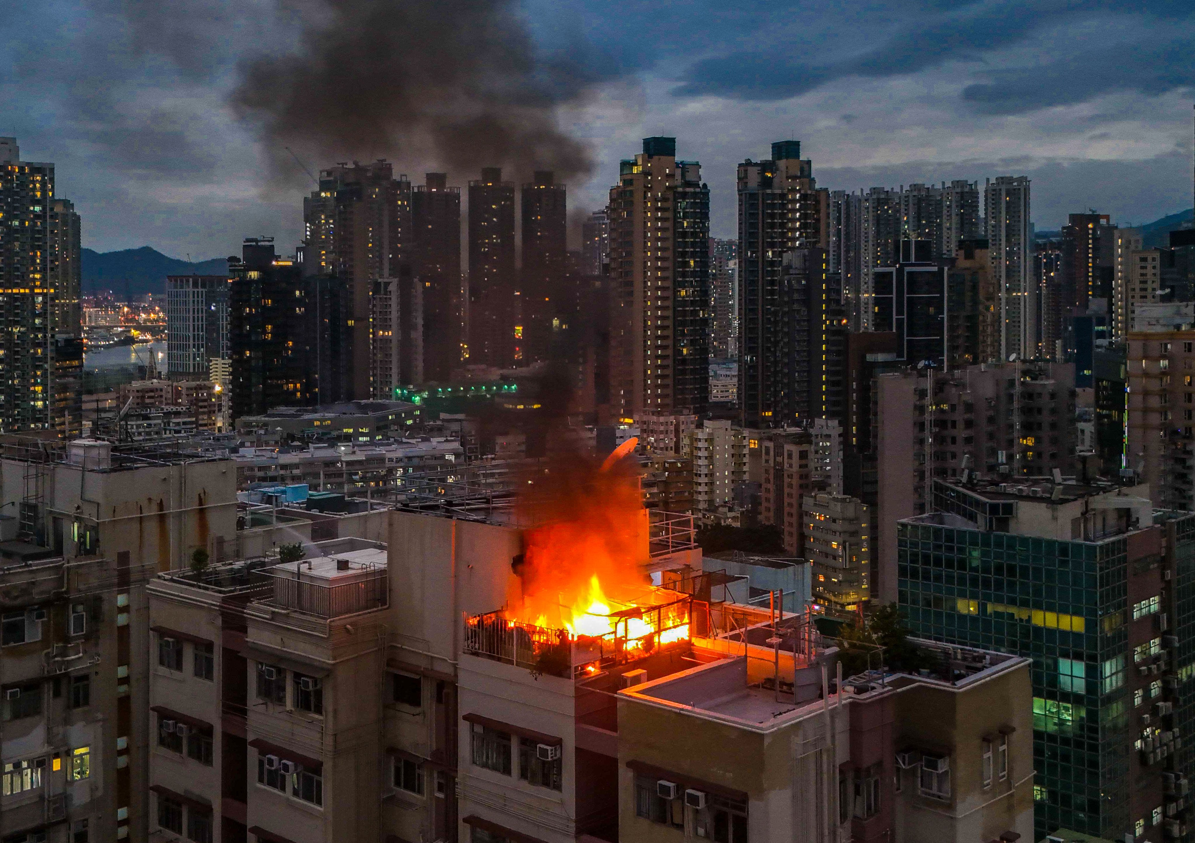 Firefighters are battling a rooftop blaze at a residential building in Hong Kong’s Mong Kok. Photo: Edmond So