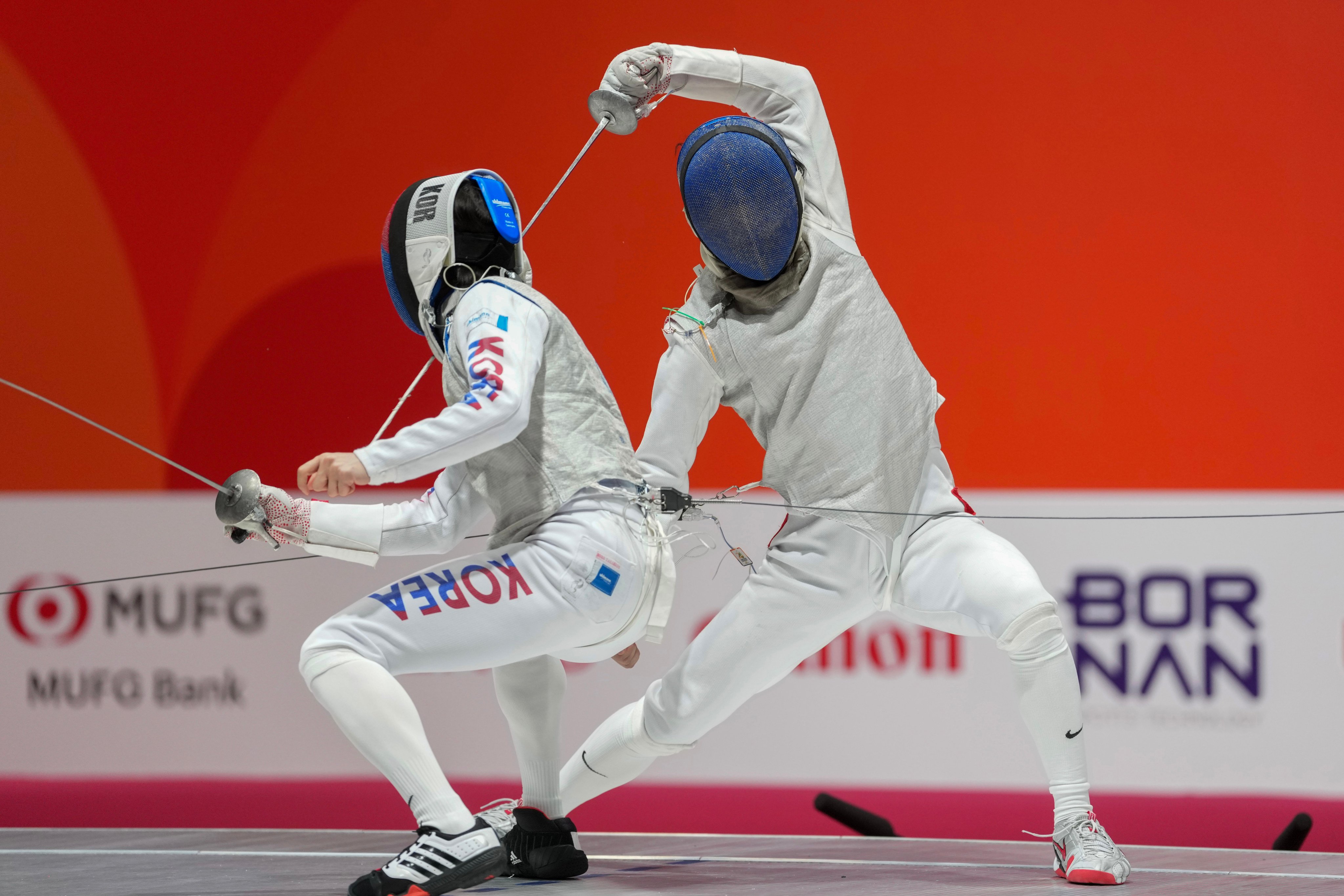 Harris Ho (right) won the men’s foil team silver medal at the Asian Games in Japan. Photo: Sam Tsang