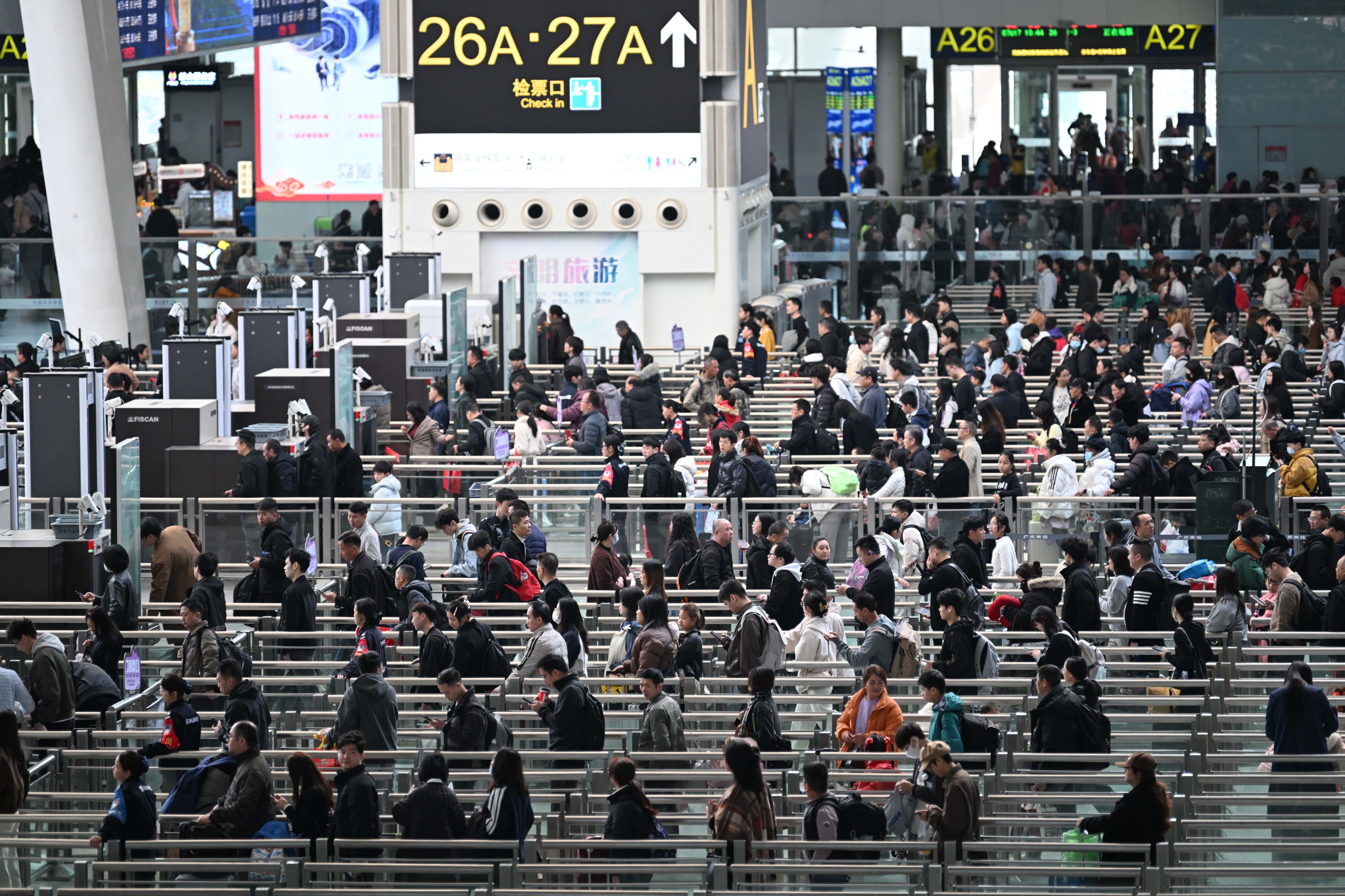 Passengers queue at Guangzhou South Railway Station in China’s southern province of Guangdong. Photo: Xinhua