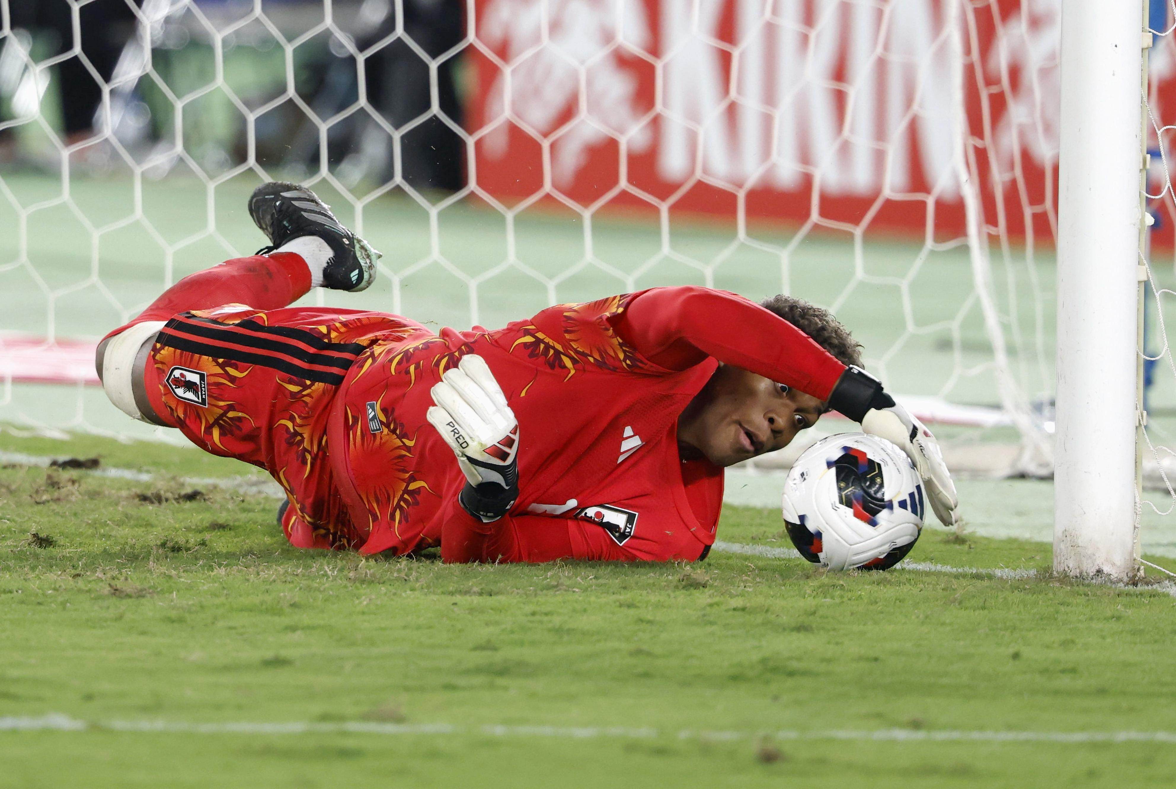 Japan’s Zion Suzuki saves a penalty during his side’s Kirin Cup semi-final against Ecuador. Photo: Kyodo