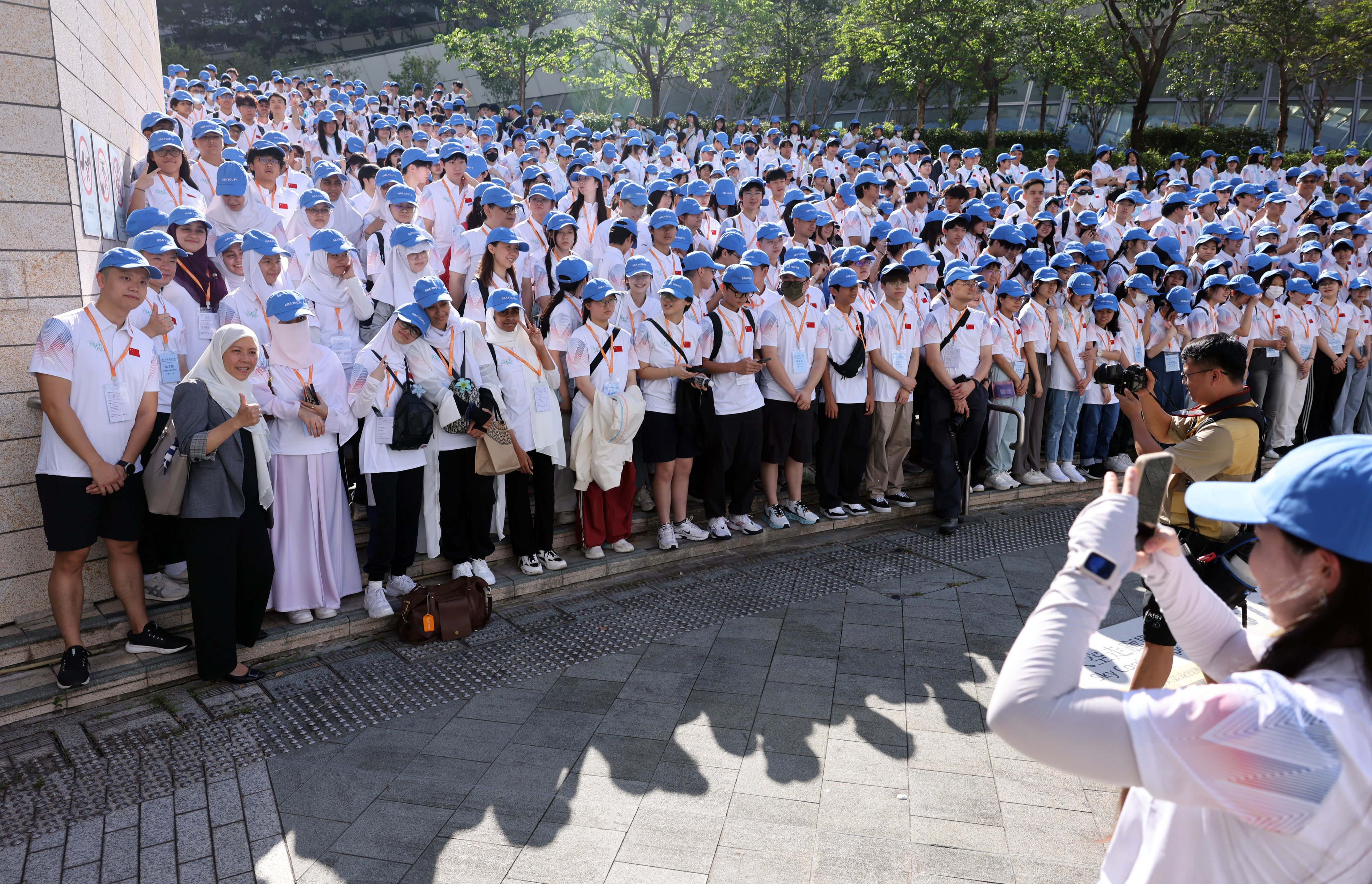 Secondary school students, teachers and volunteers pose for photos at West Kowloon station in 2025, ahead of the Dongjiang Water: Source Journey study tour. Photo: Nora Tam