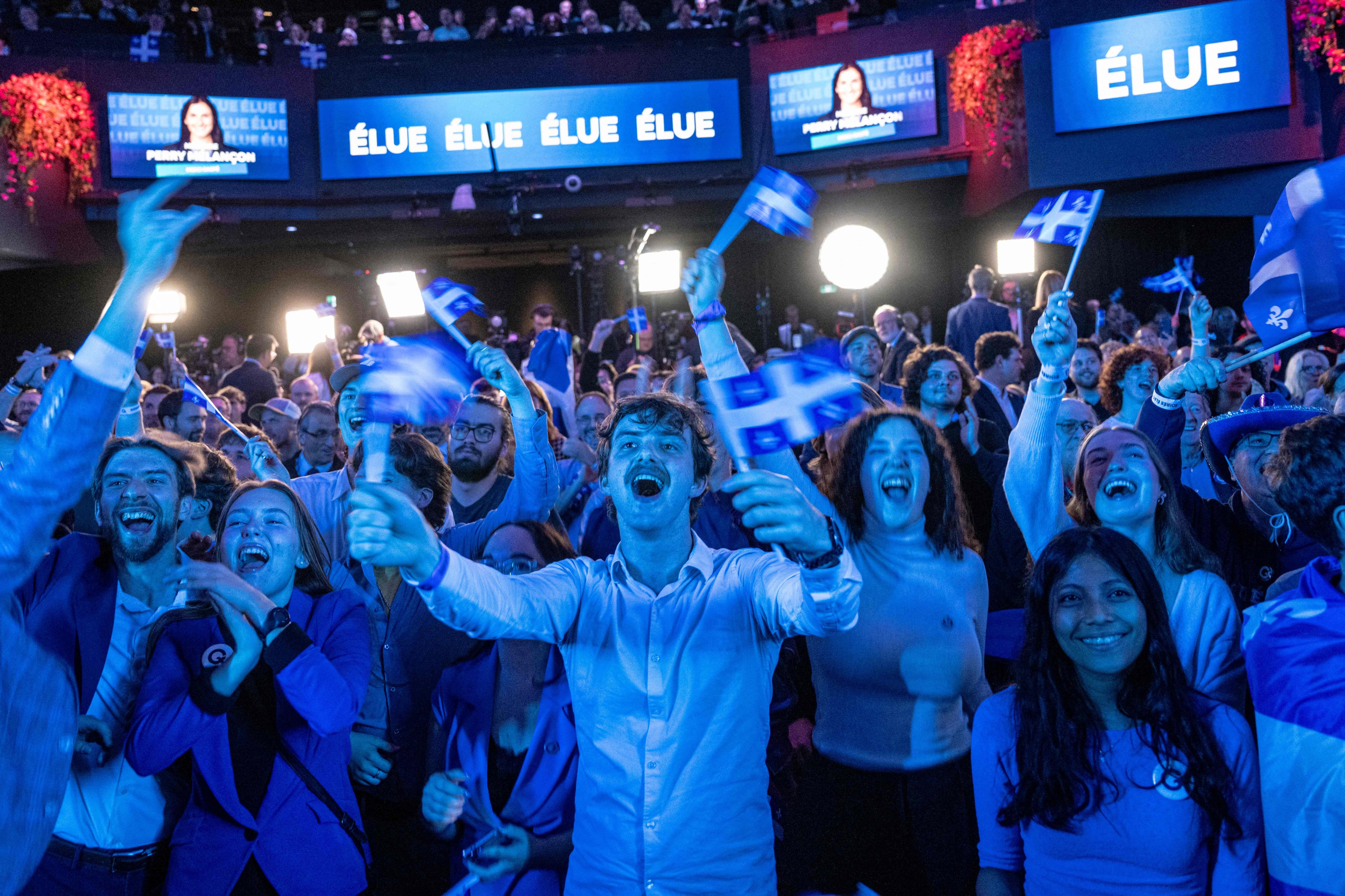 Parti Quebecois supporters cheer as members of the party are elected. Photo: AFP