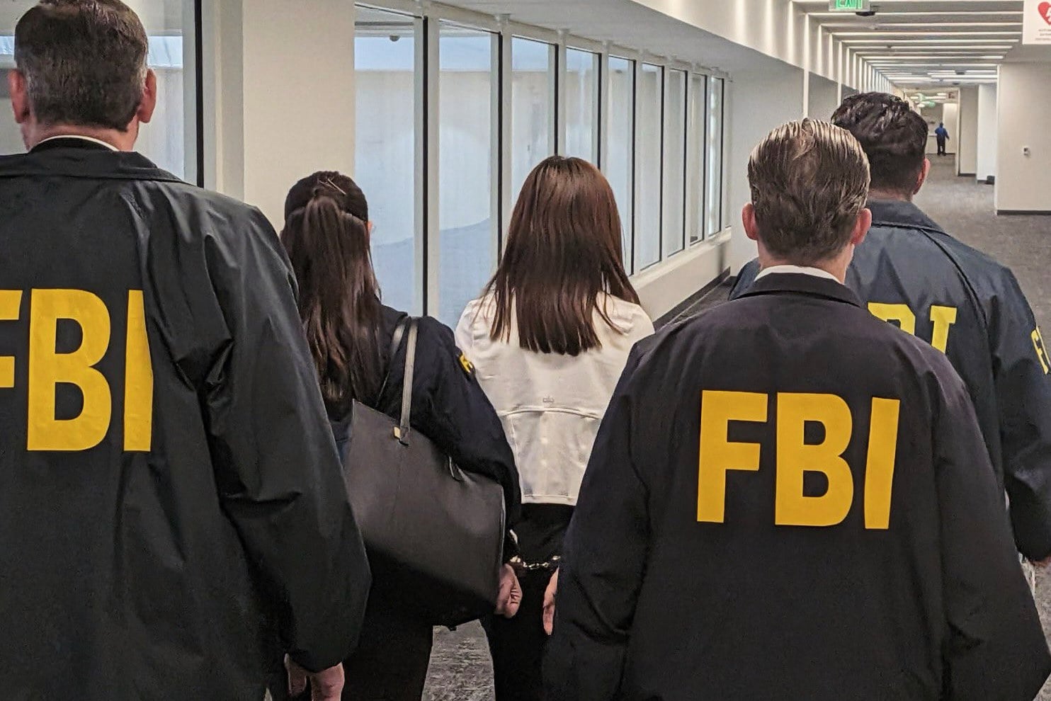 Wanying Zhang is arrested in Los Angeles on Sunday. Photo: FBI via AP