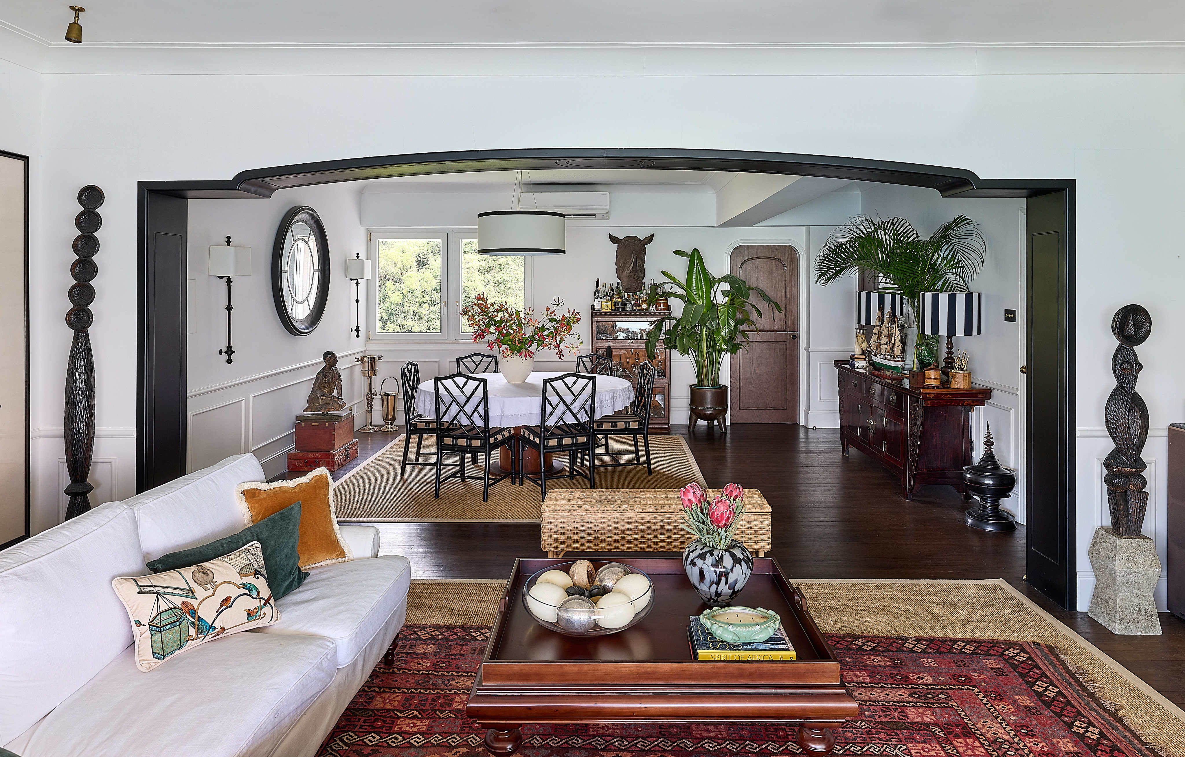A dramatic black archway separates the living and dining areas of a Pok Fu Lam apartment renovated by Rosheen Rodwell of Rosheen Rodwell Interiors. Photo: Michael Perini
