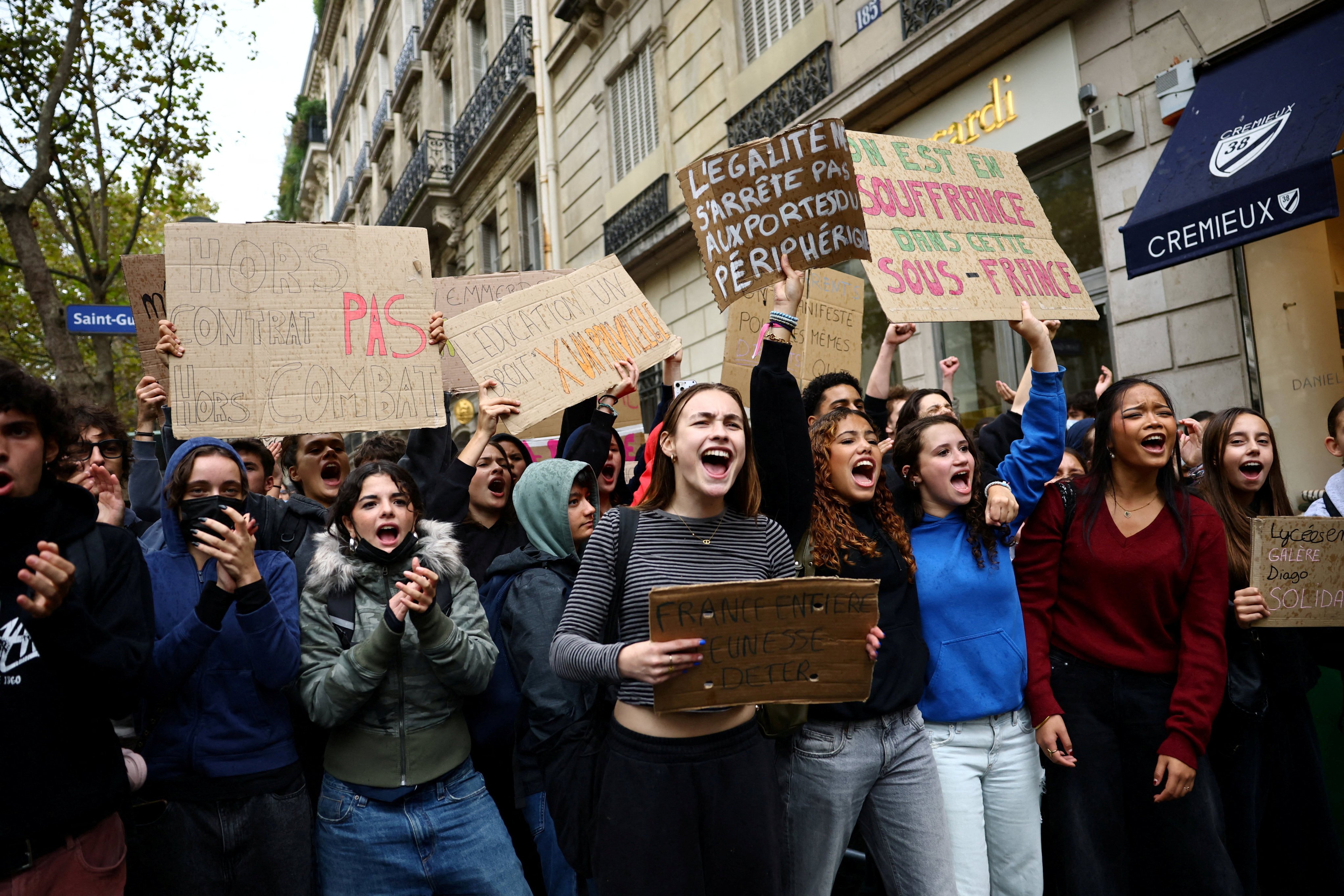 Protesters shout slogans and hold placards in a street during a blockade of Sciences Po university in Paris, France, on Wednesday. Photo: Reuters