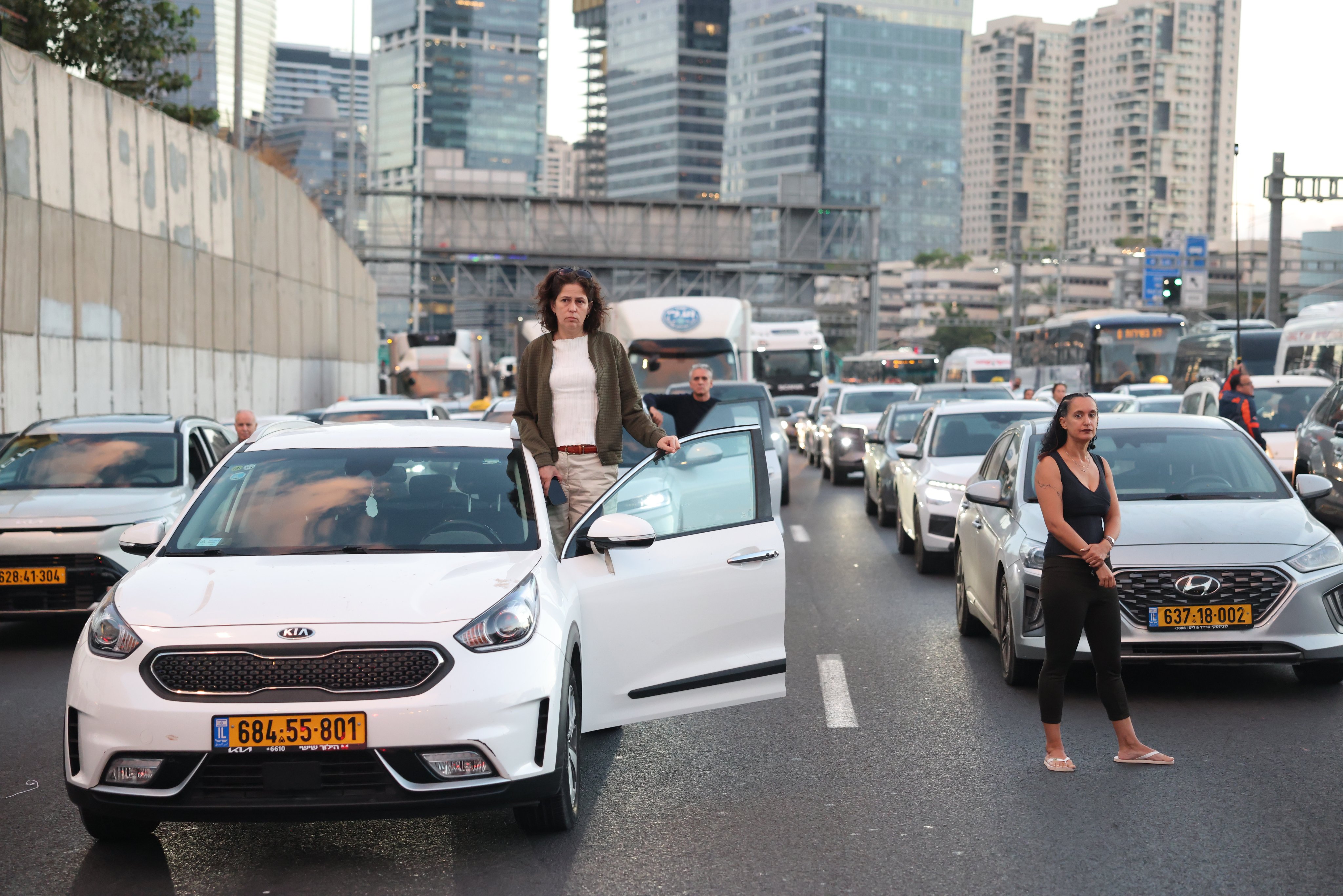 People stand outside their cars during a moment of silence in Tel Aviv. Photo: EPA