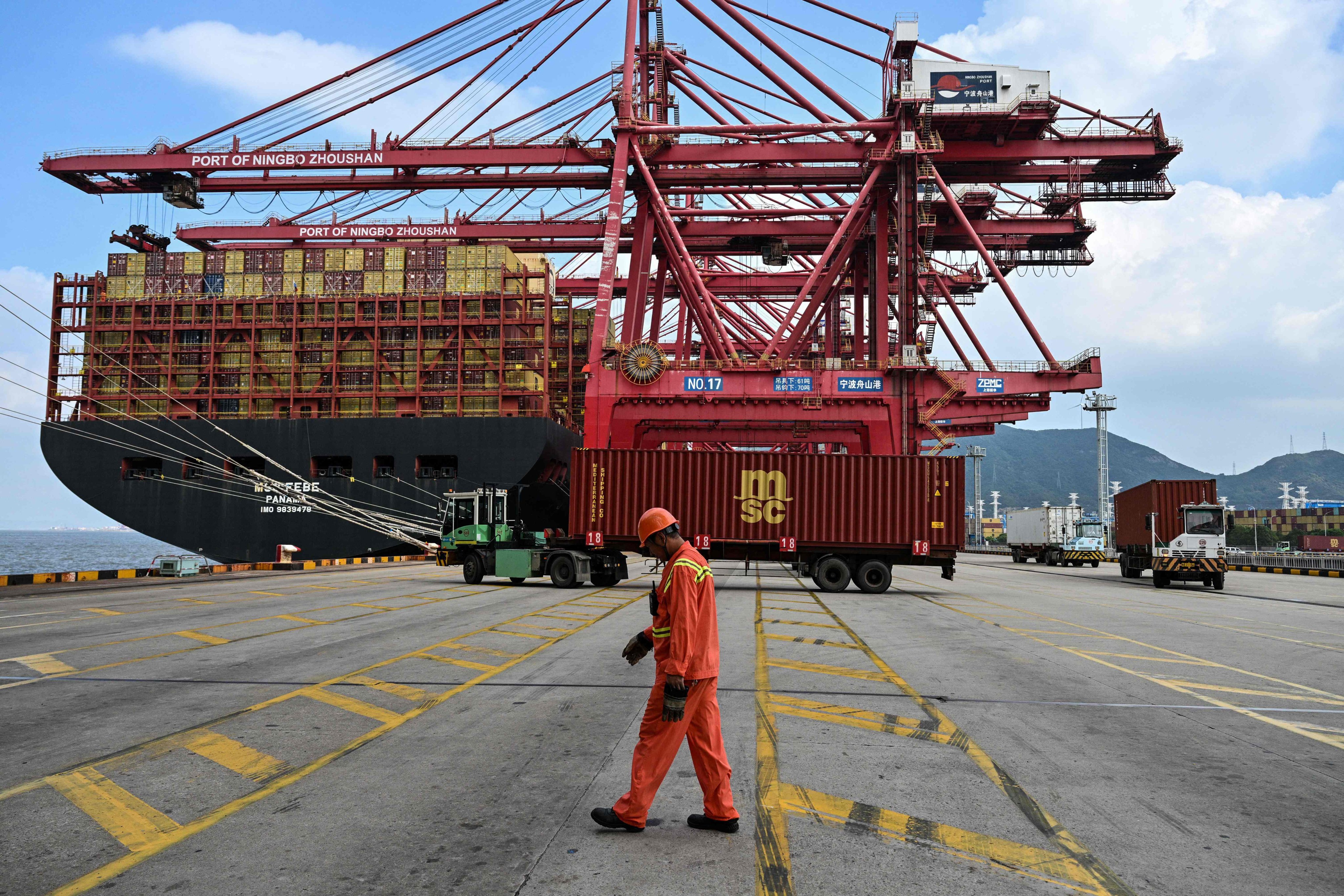 Cranes load containers onto a ship at the Port of Ningbo-Zhoushan in Ningbo, China’s eastern Zhejiang province, on September 22. Photo: AFP
