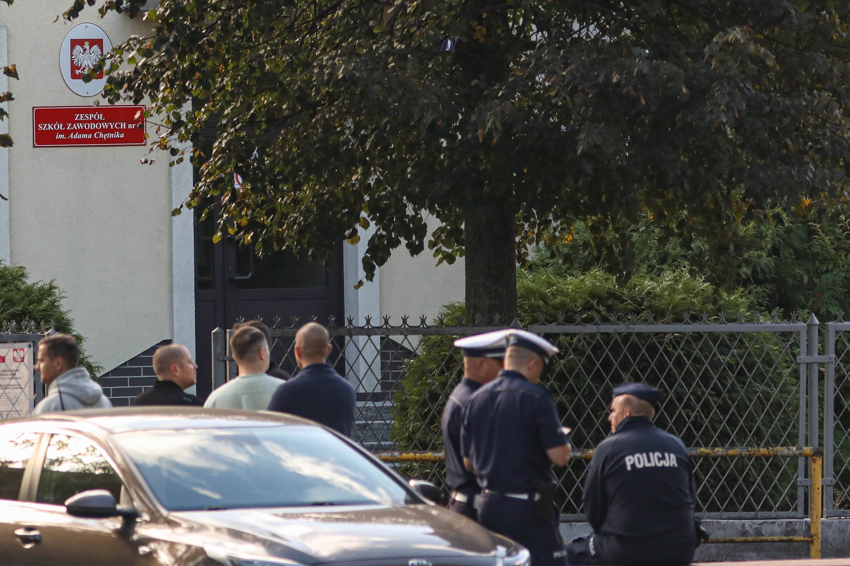 Emergency service vehicles and police officers at the scene of a knife attack at the Adam Chetnik Vocational School Complex No. 4 in Ostroleka, Poland, on Wednesday. Photo: EPA