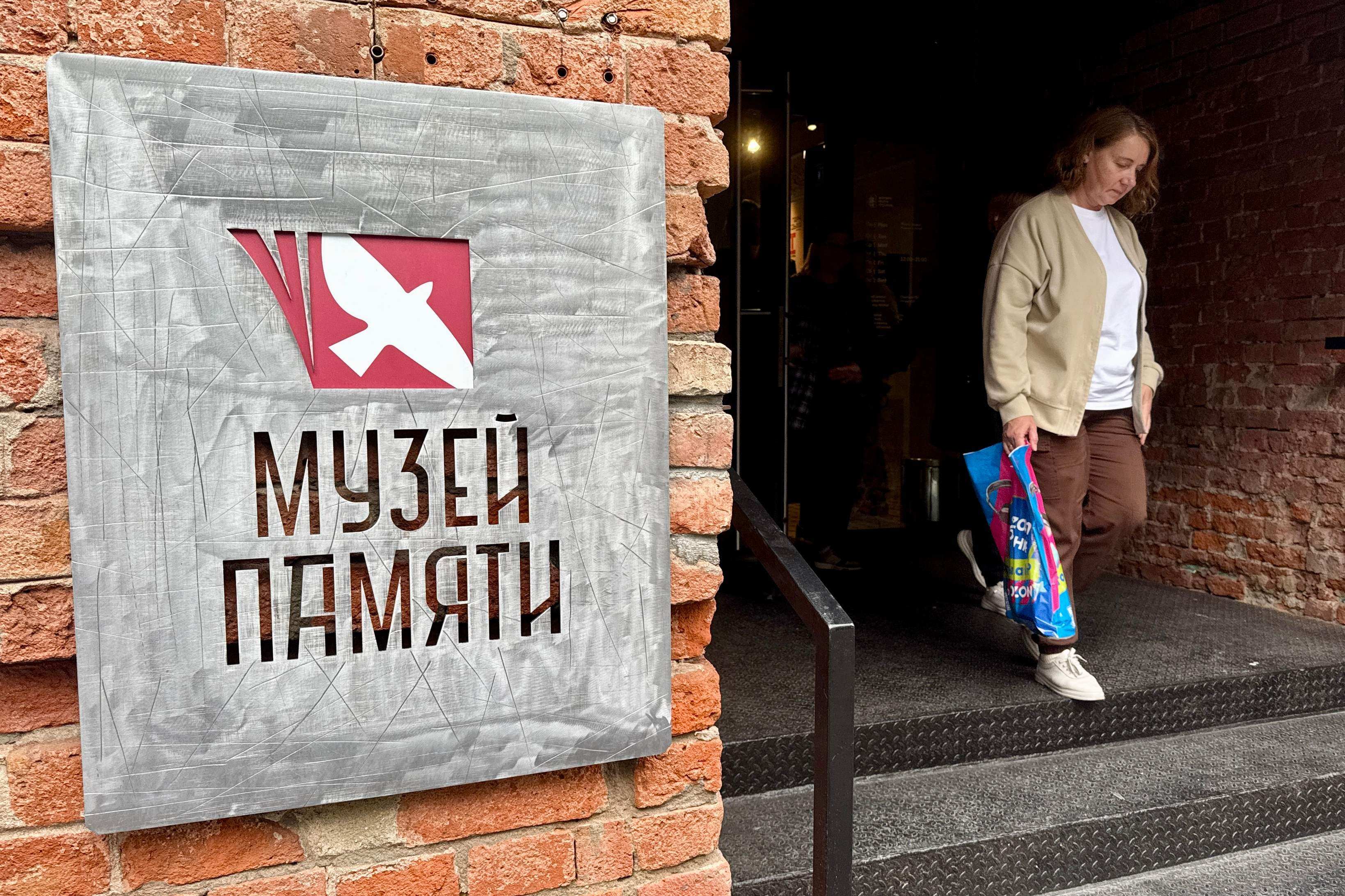 A visitor exits the Museum of Memory in Moscow in August. Photo: AFP