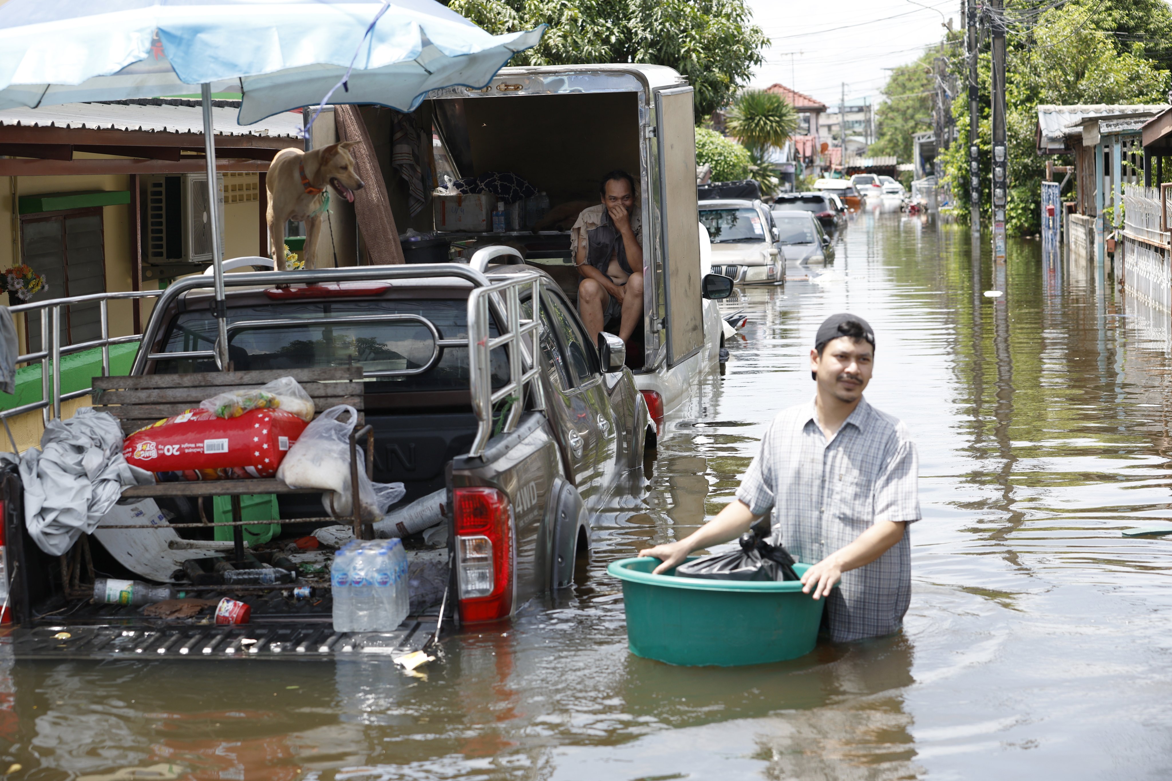 Stranded residents navigate floodwaters in Bangkok’s Lat Krabang district, Thailand, on September 29. Photo: EPA
